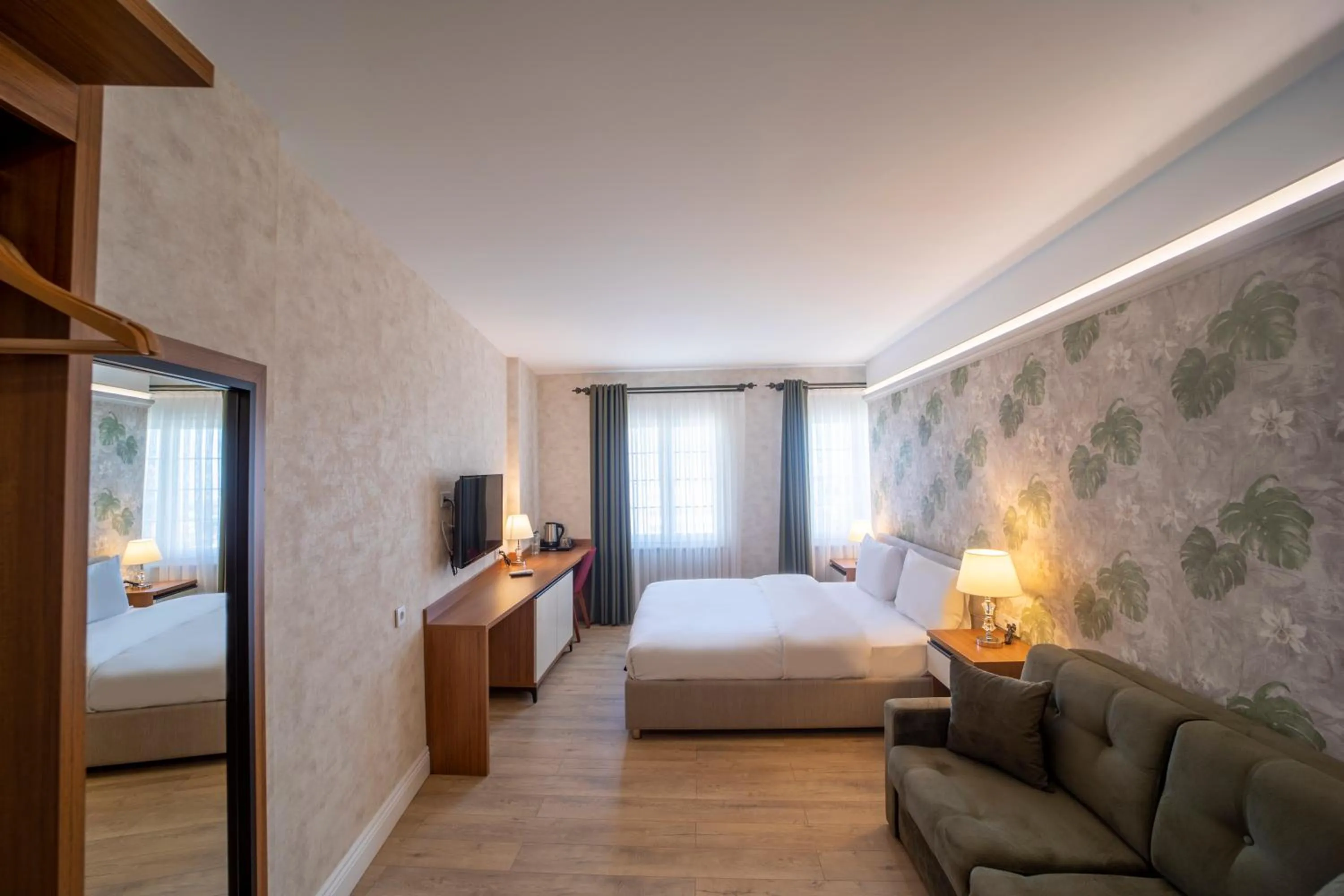 Bed in MELL City Suites Hotel