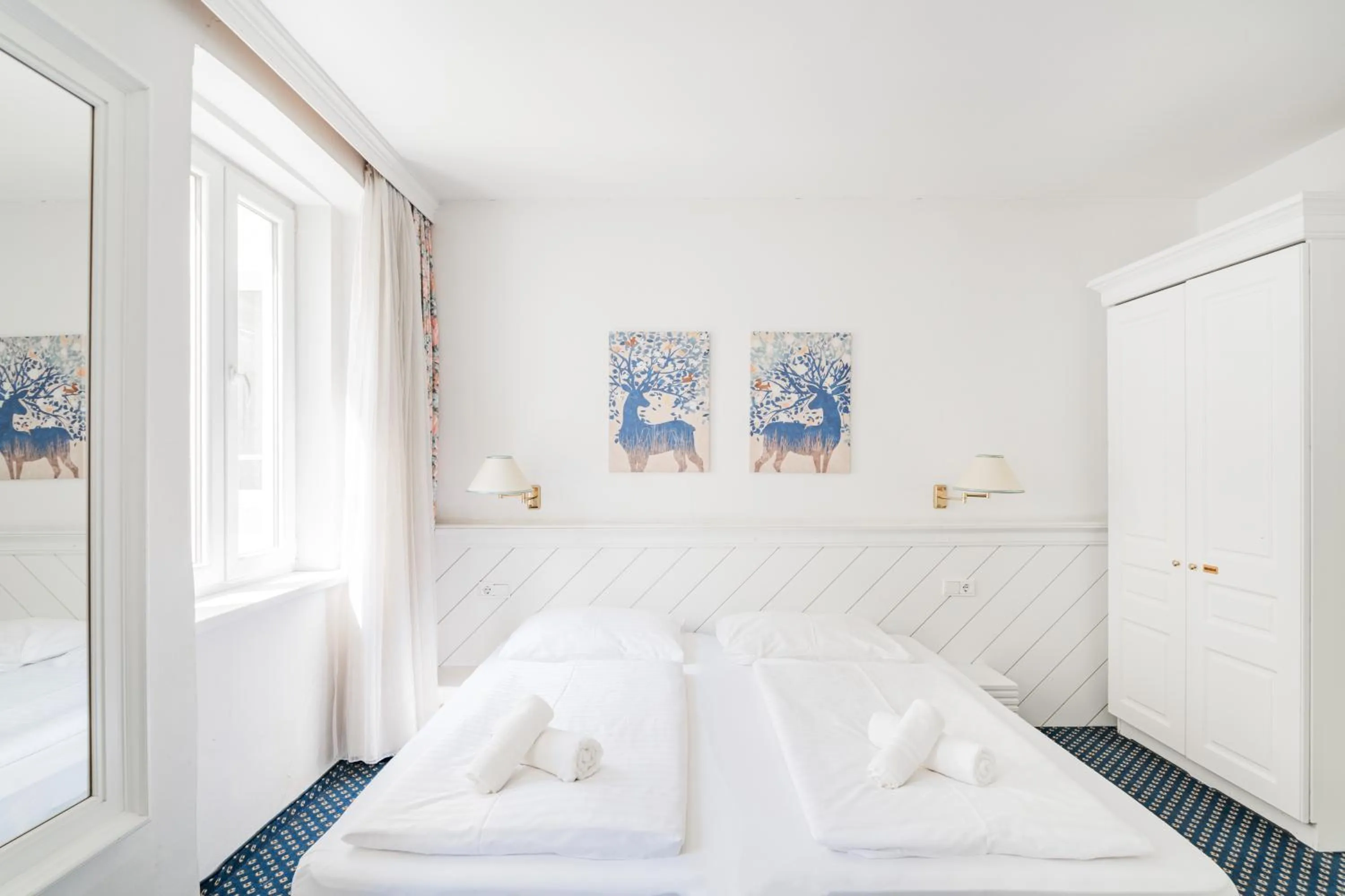 Bed in Self-Check-In Hotel Adlon