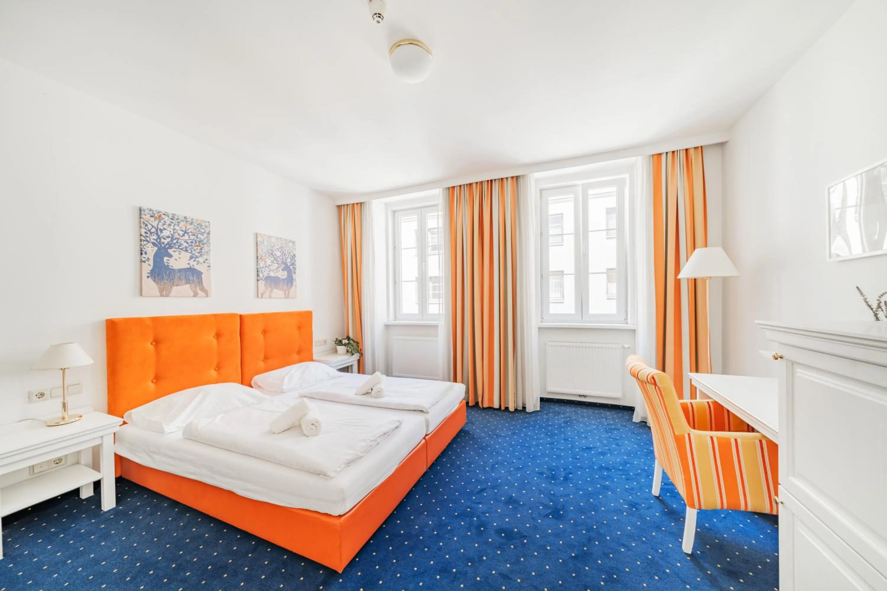 Bed in Self-Check-In Hotel Adlon