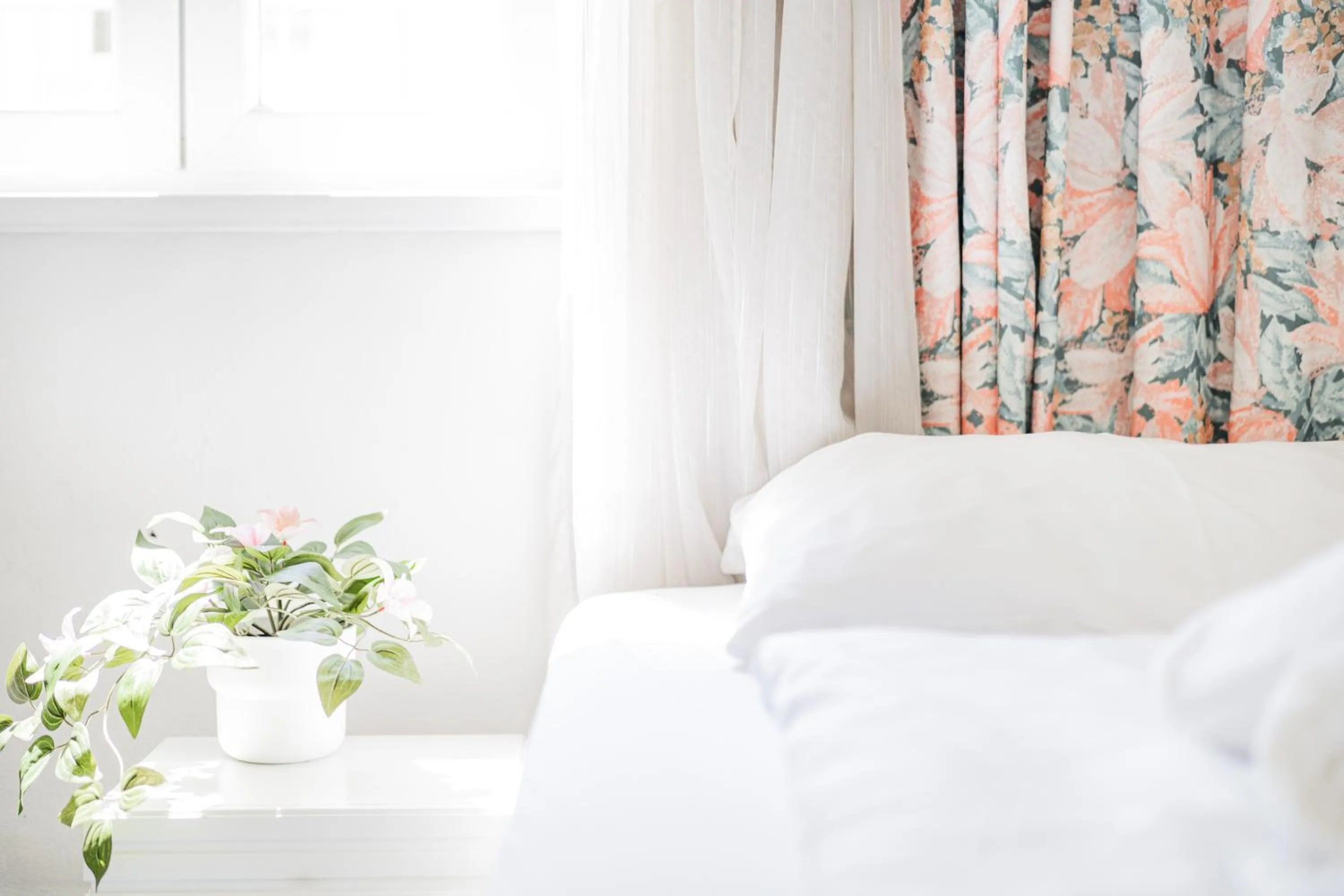 Bed in Self-Check-In Hotel Adlon