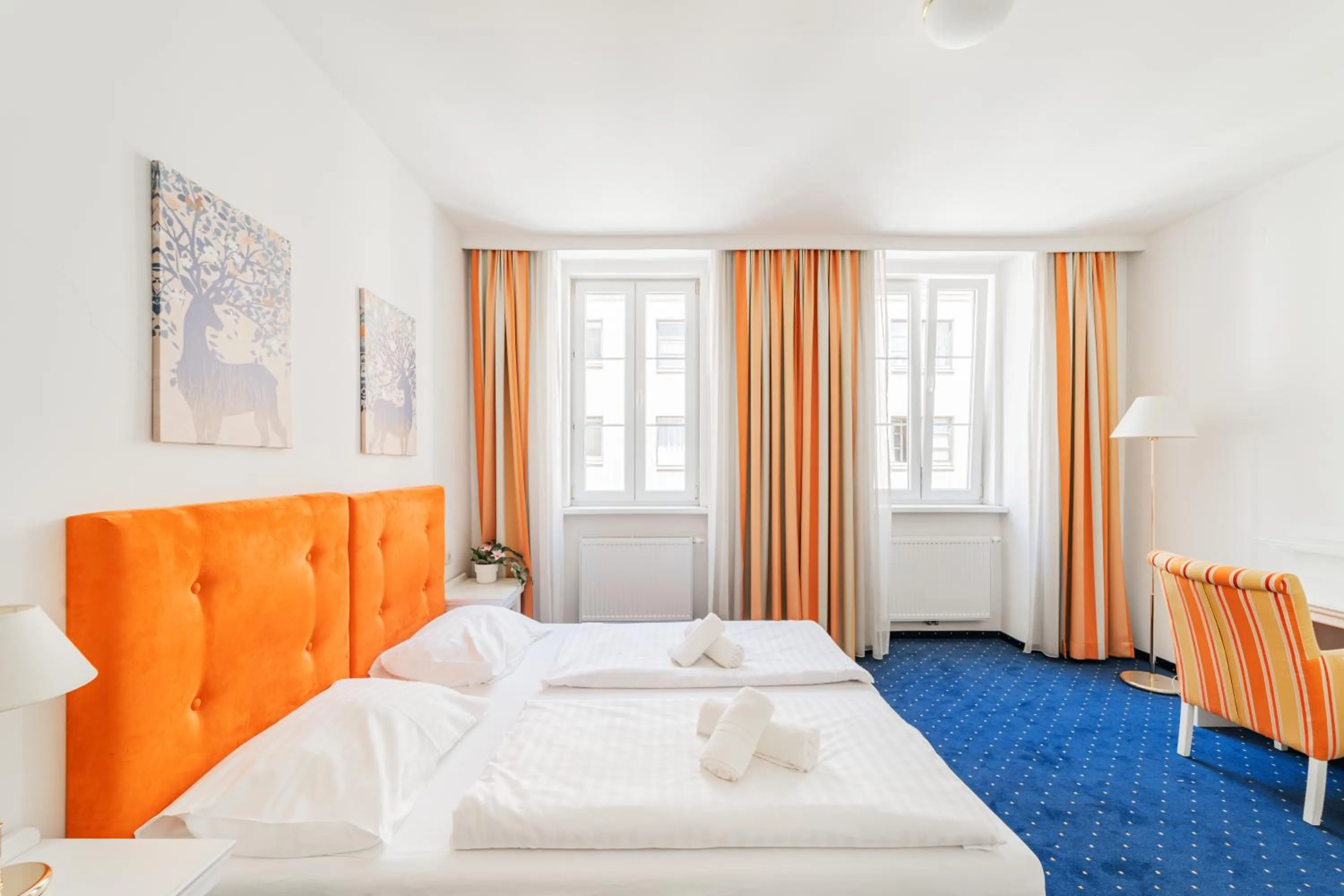 Bed in Self-Check-In Hotel Adlon