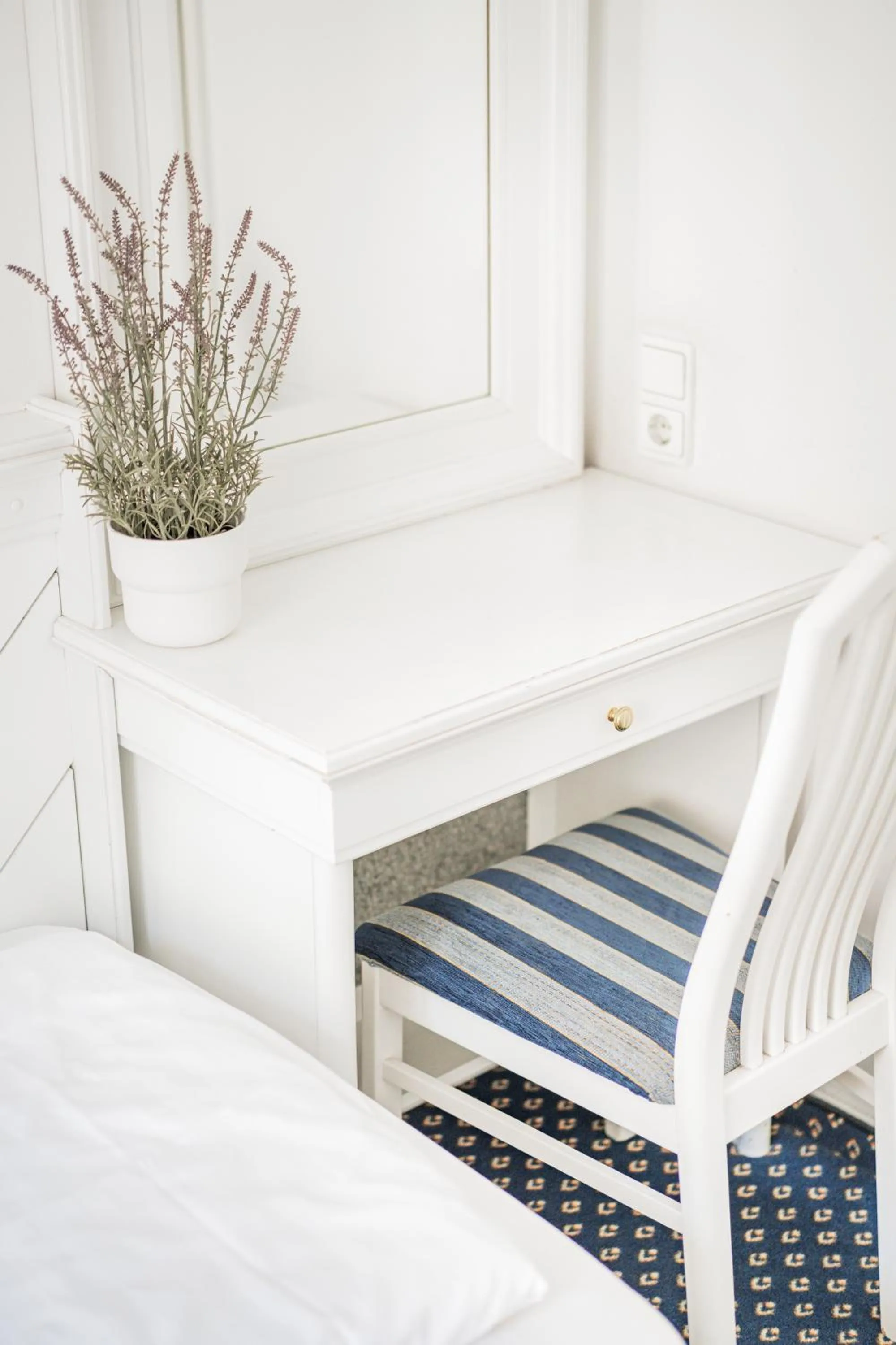 Bed in Self-Check-In Hotel Adlon