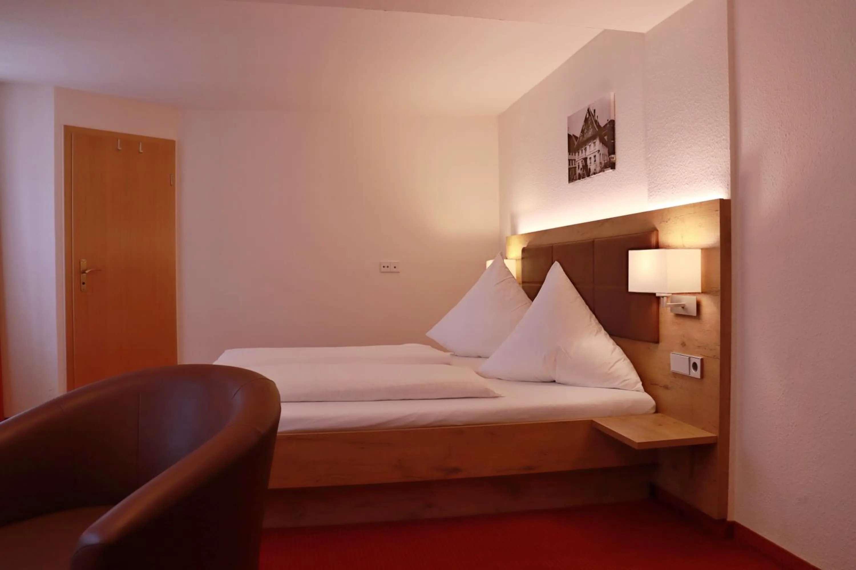 Bed in Hotel Restaurant Schwarzer Adler