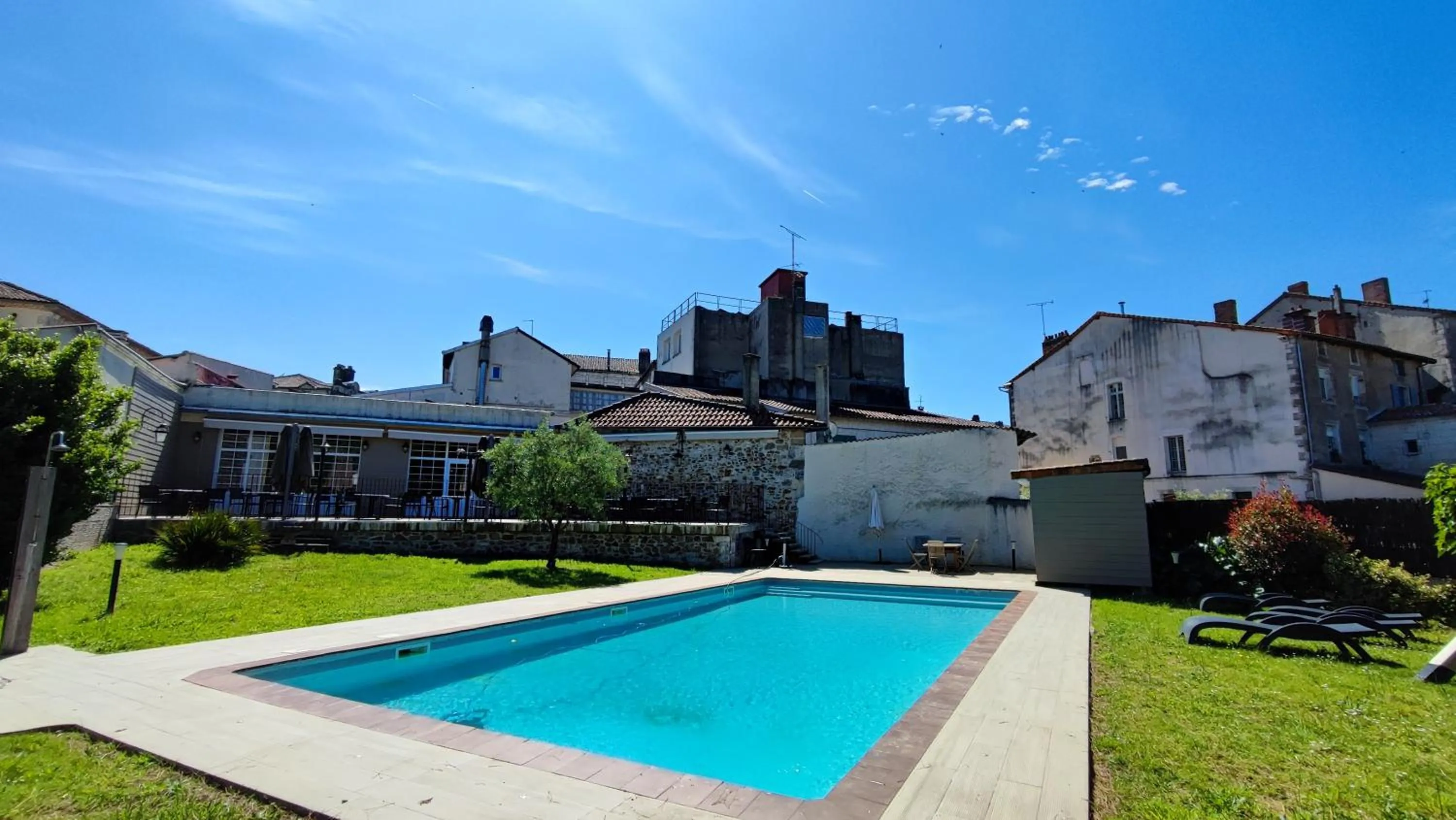 Garden view in Logis Grand Hotel Pelisson