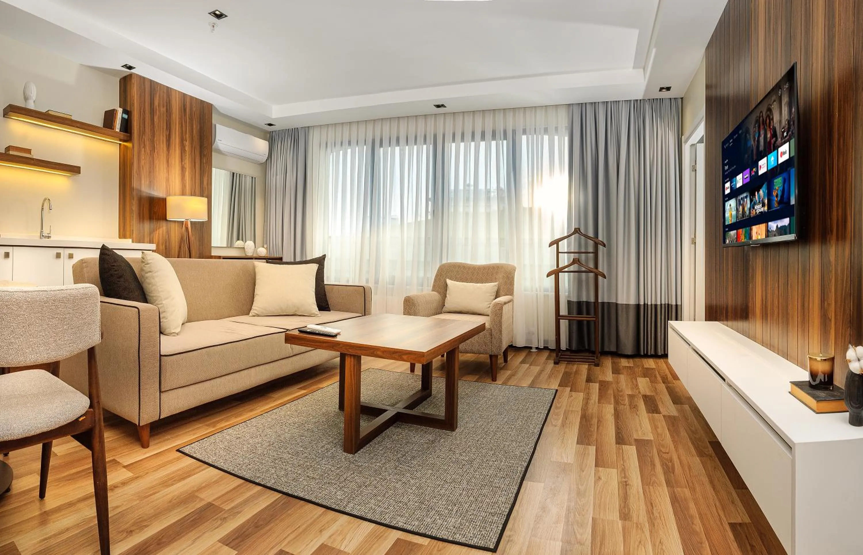 Communal lounge/ TV room in La Mia Suites