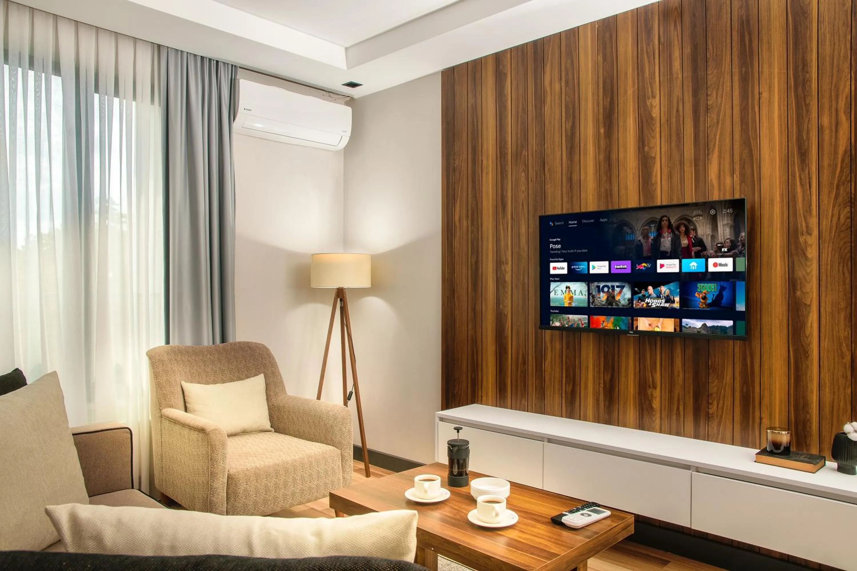 Communal lounge/ TV room in La Mia Suites