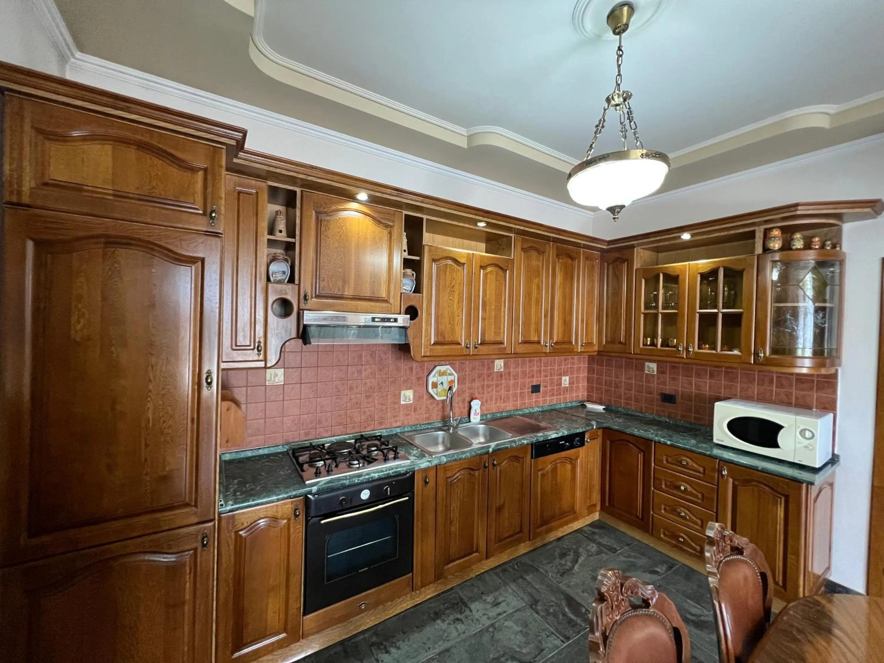 Kitchen or kitchenette in Green Garden Villa