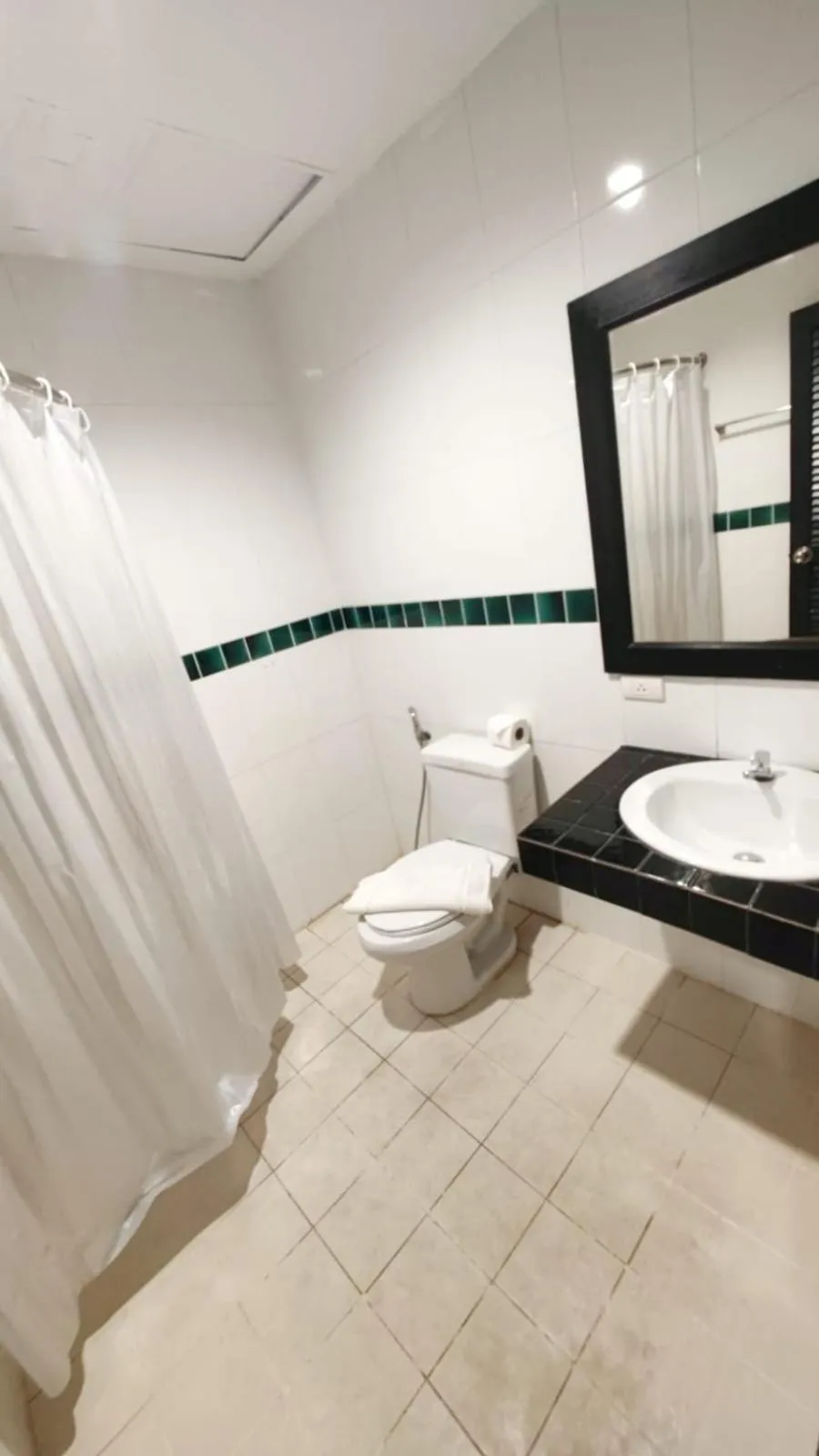 Toilet in Cocoon APK Resort & Spa