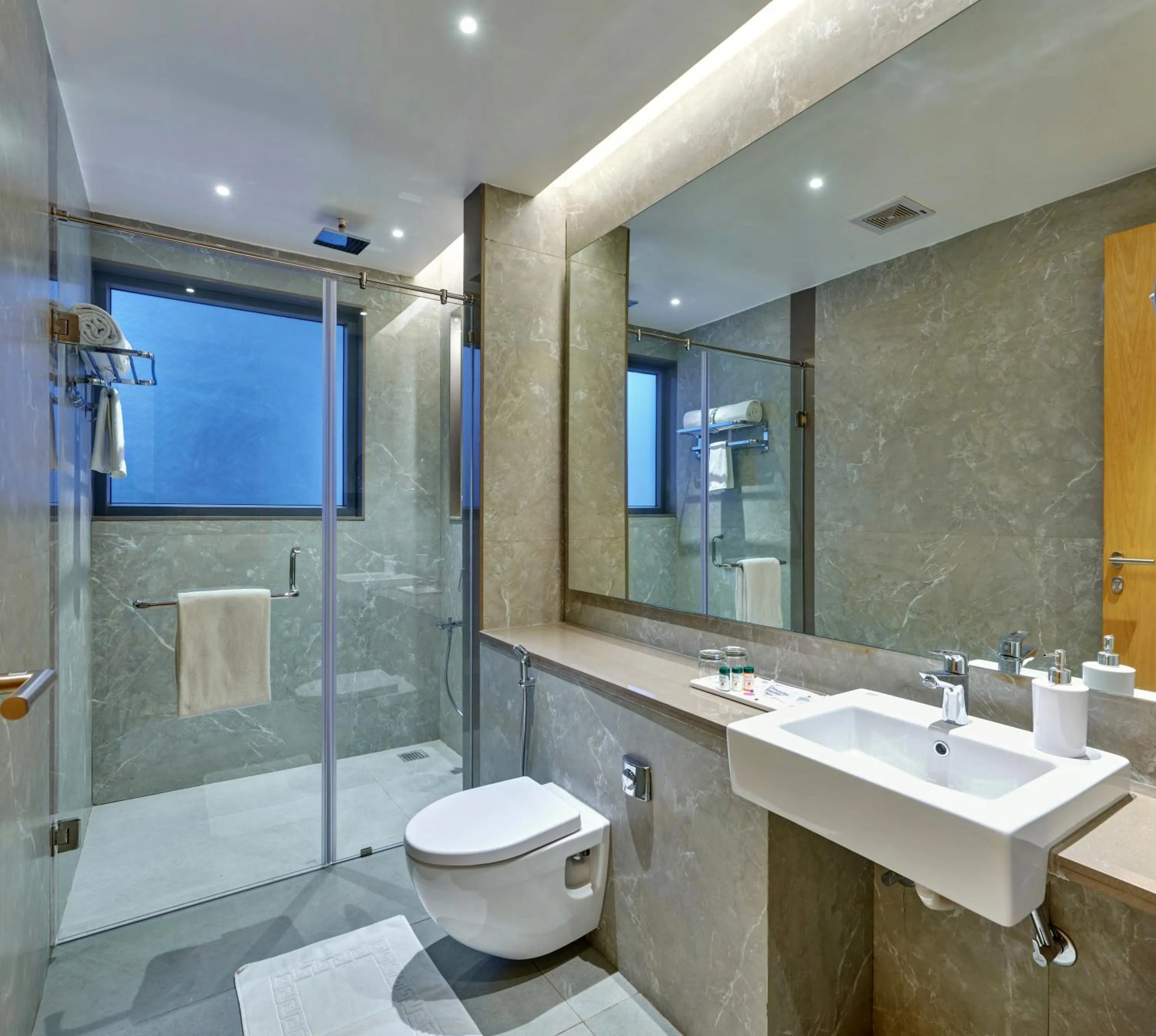 Bathroom in Regenta Place Raysons Kolhapur