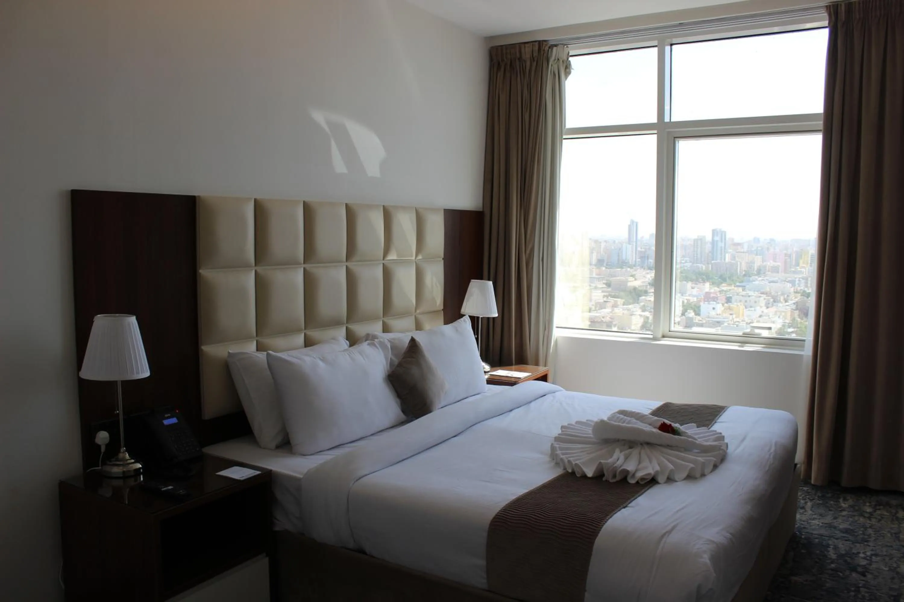 Bed in Dolphin Continental Hotel