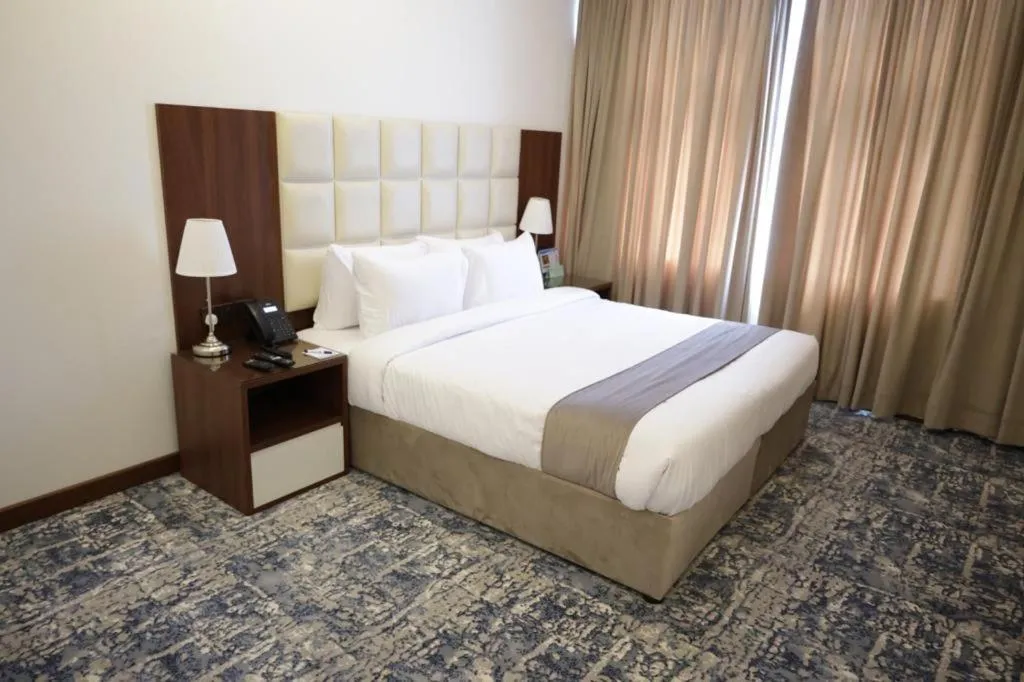 Bed in Dolphin Continental Hotel