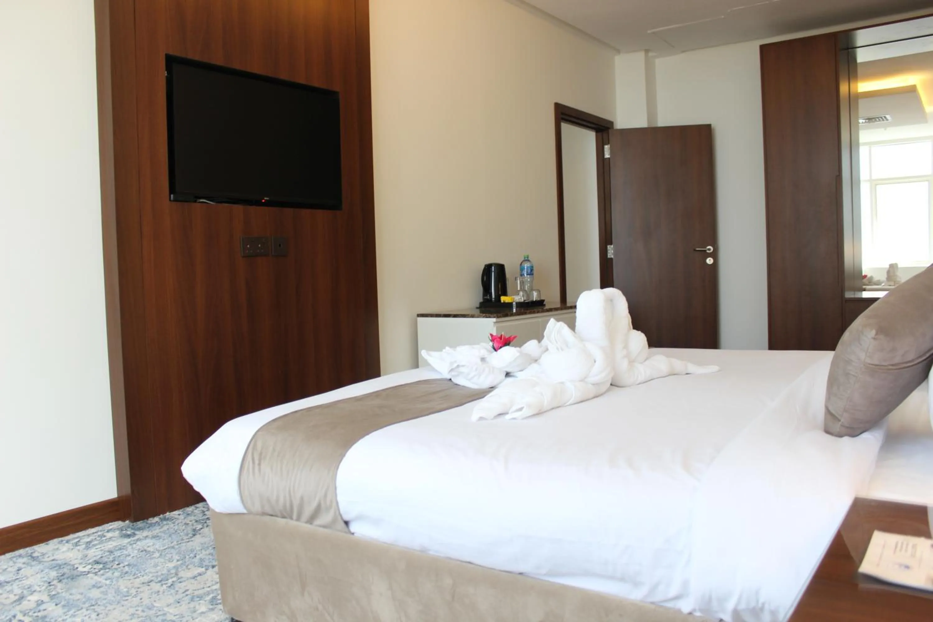 Bed in Dolphin Continental Hotel