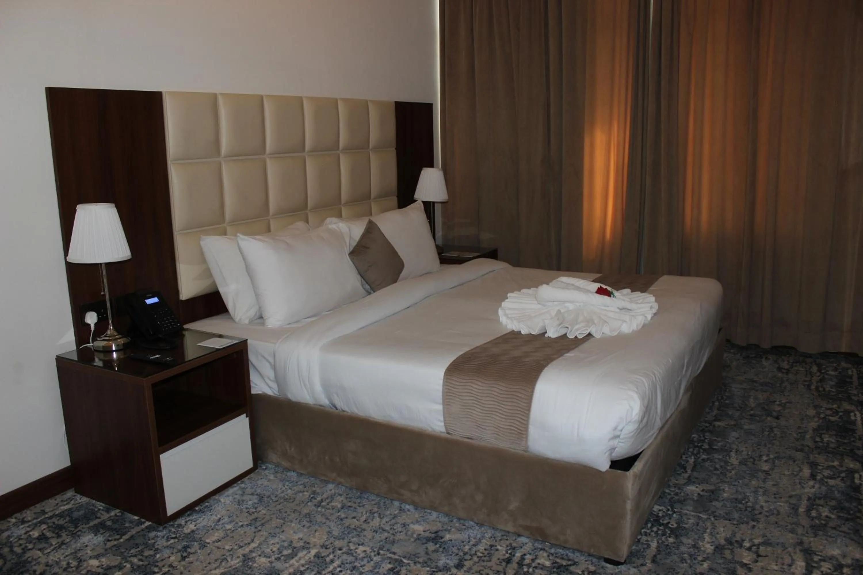 Bed in Dolphin Continental Hotel