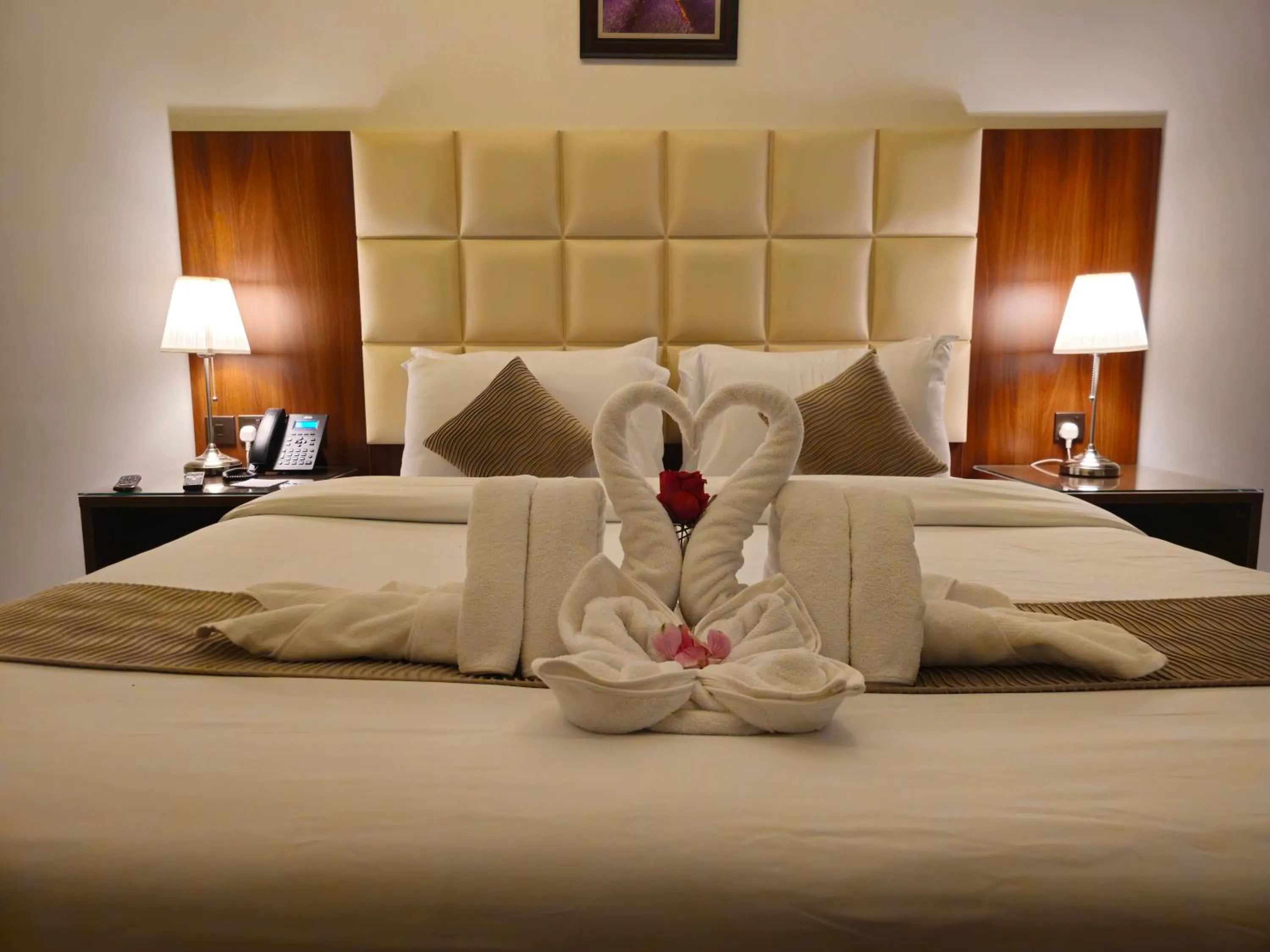 Bed in Dolphin Continental Hotel