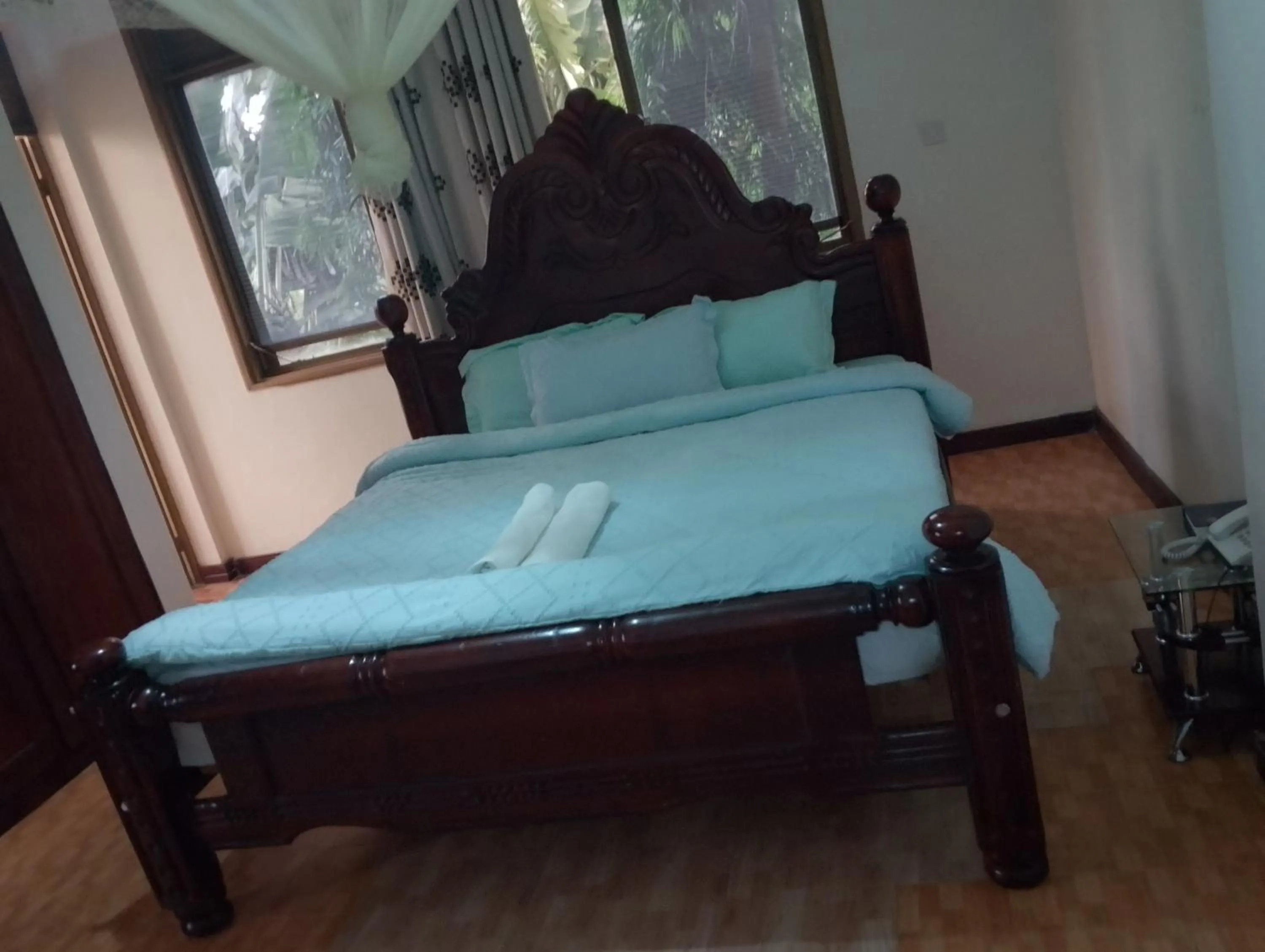 Bed in DISCOVERY COURTS HOTEL