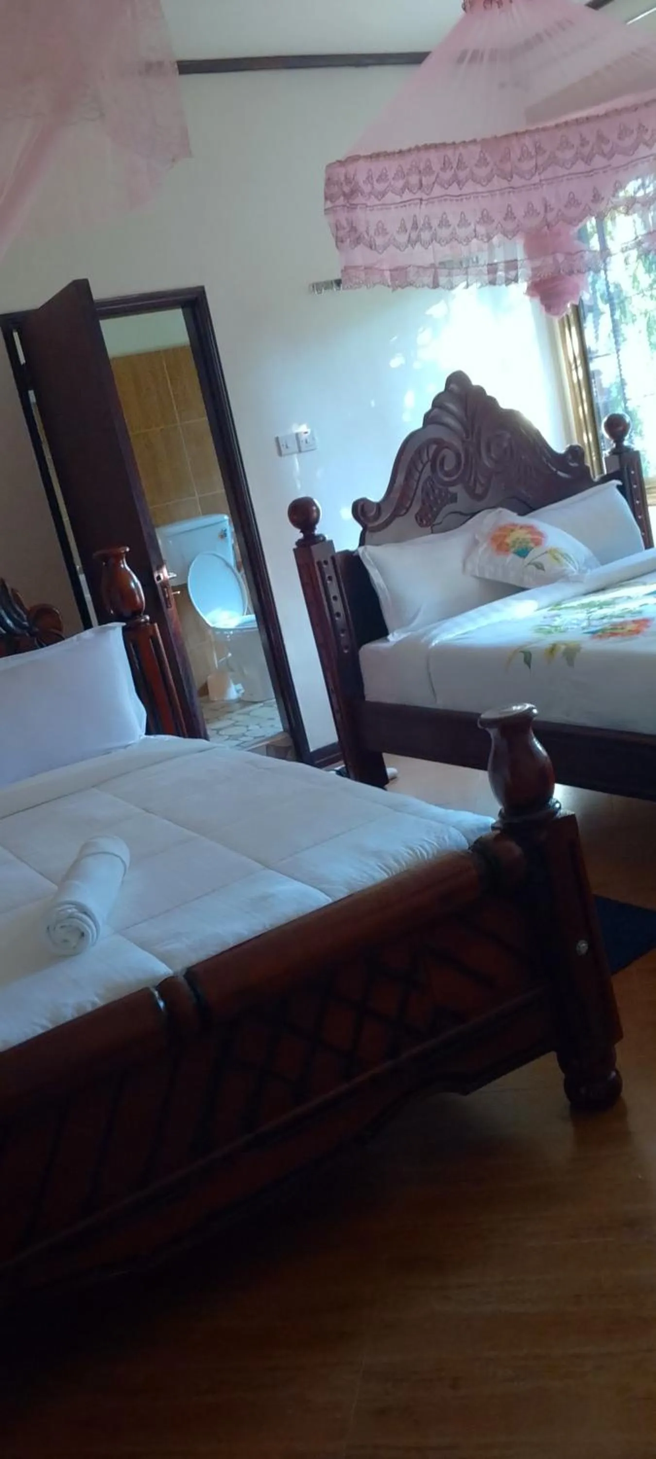 Bed in DISCOVERY COURTS HOTEL