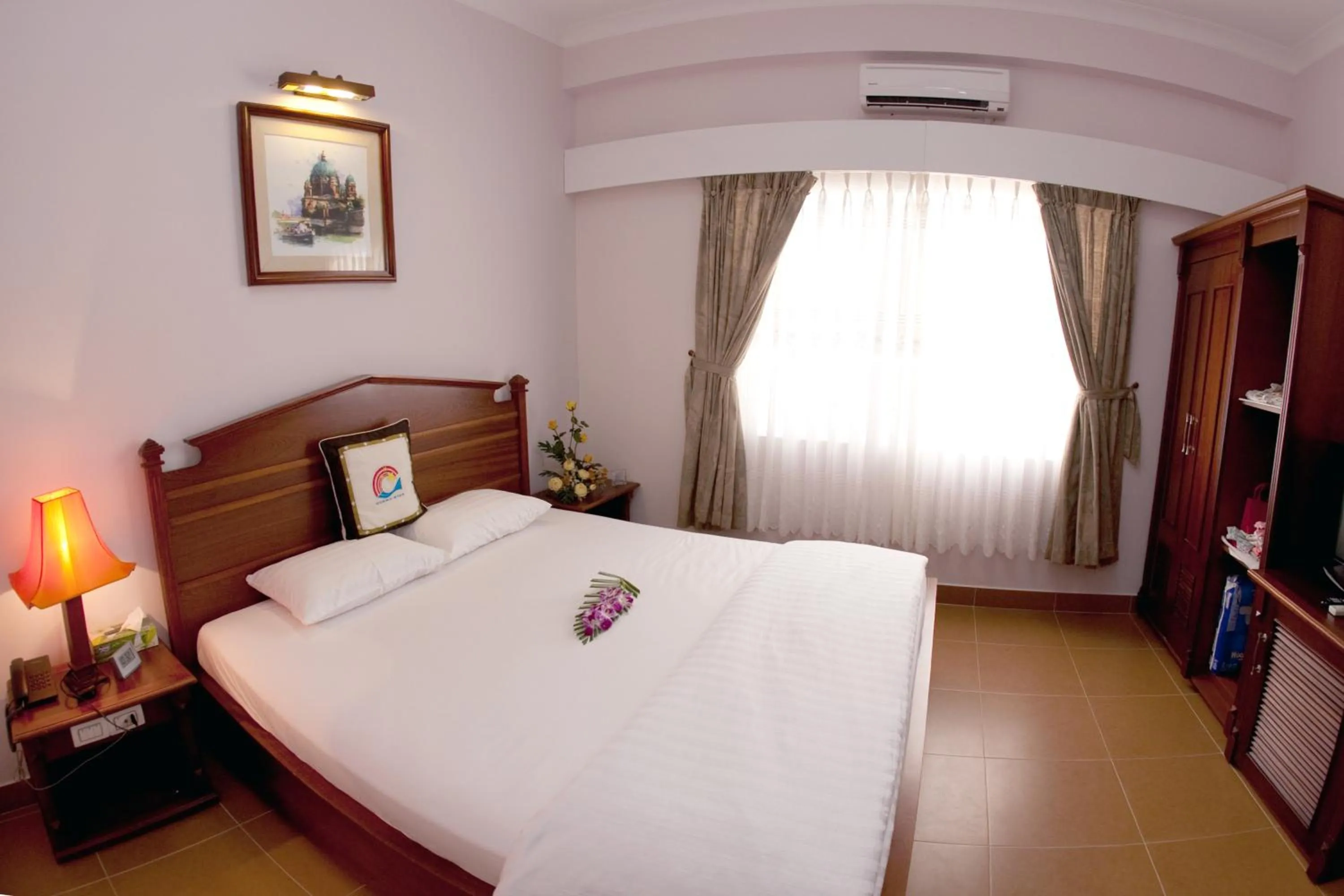 Bed in Ocean Star Hotel