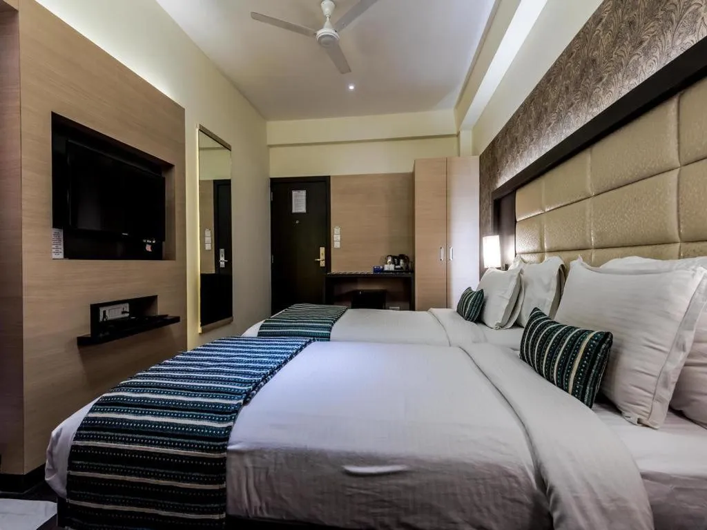 Photo of the whole room, Bed in Galaxy Beacon Hotel, Santacruz ,Mumbai