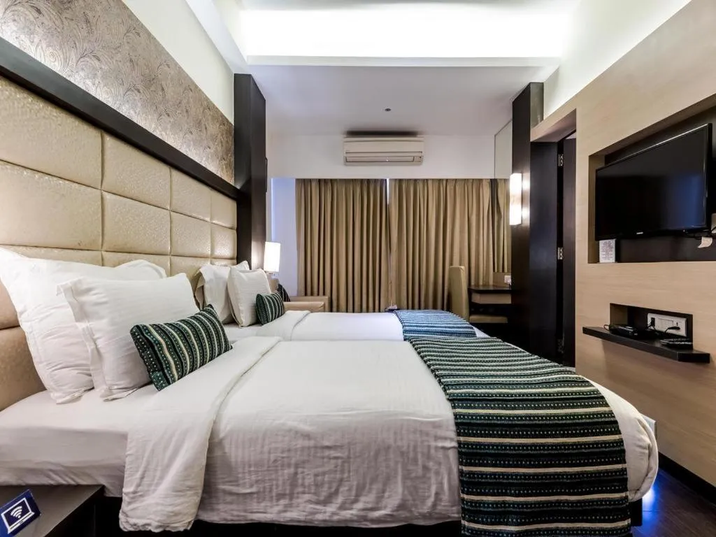 Photo of the whole room, Bed in Galaxy Beacon Hotel, Santacruz ,Mumbai