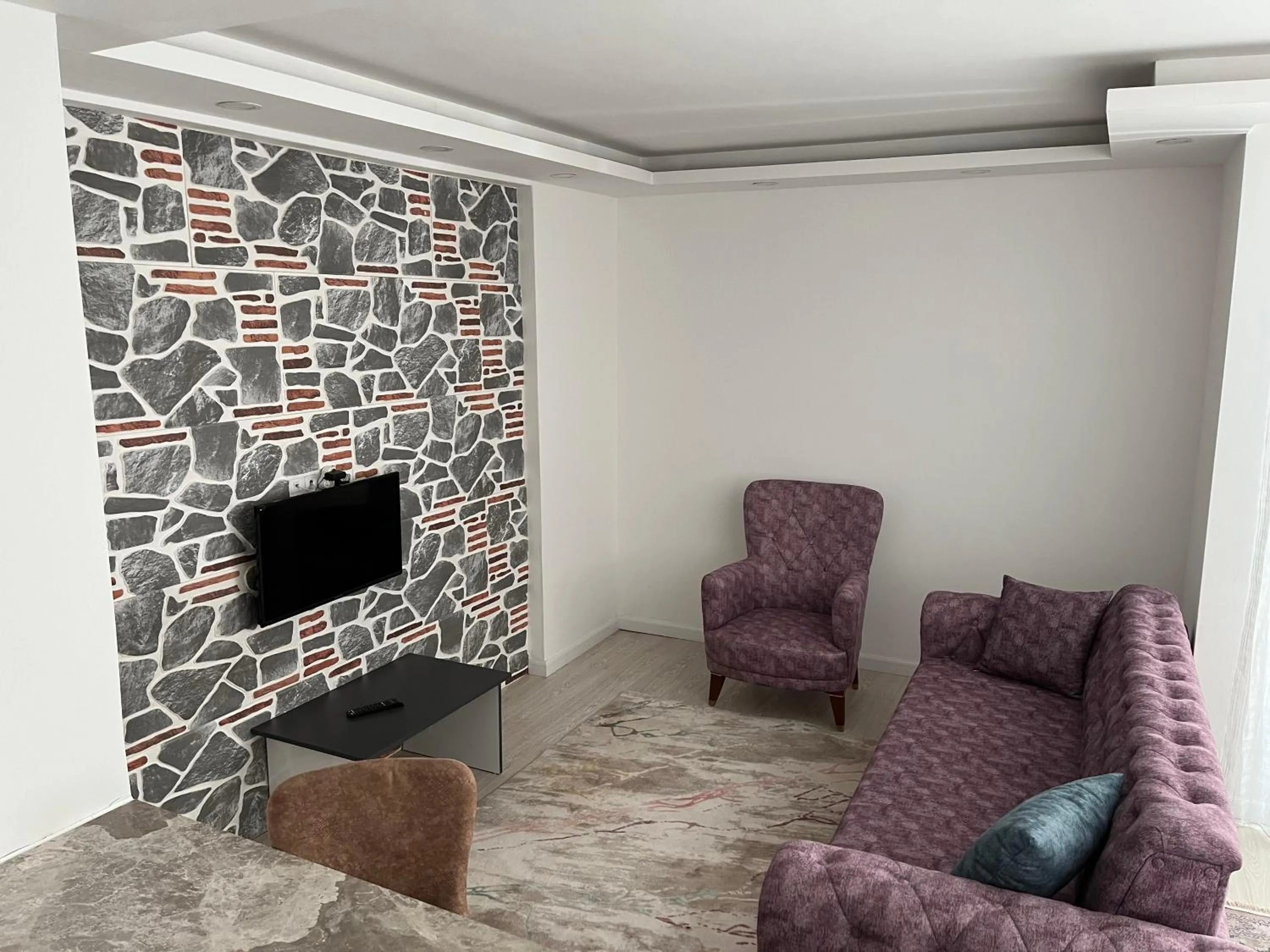 Communal lounge/ TV room in Gardenya Lara Suit Hotel