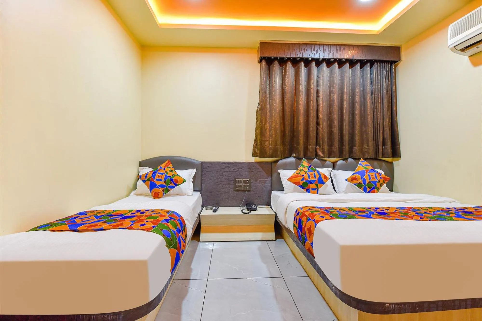 Bed in FabHotel Max Inn - Inside Himalaya Square