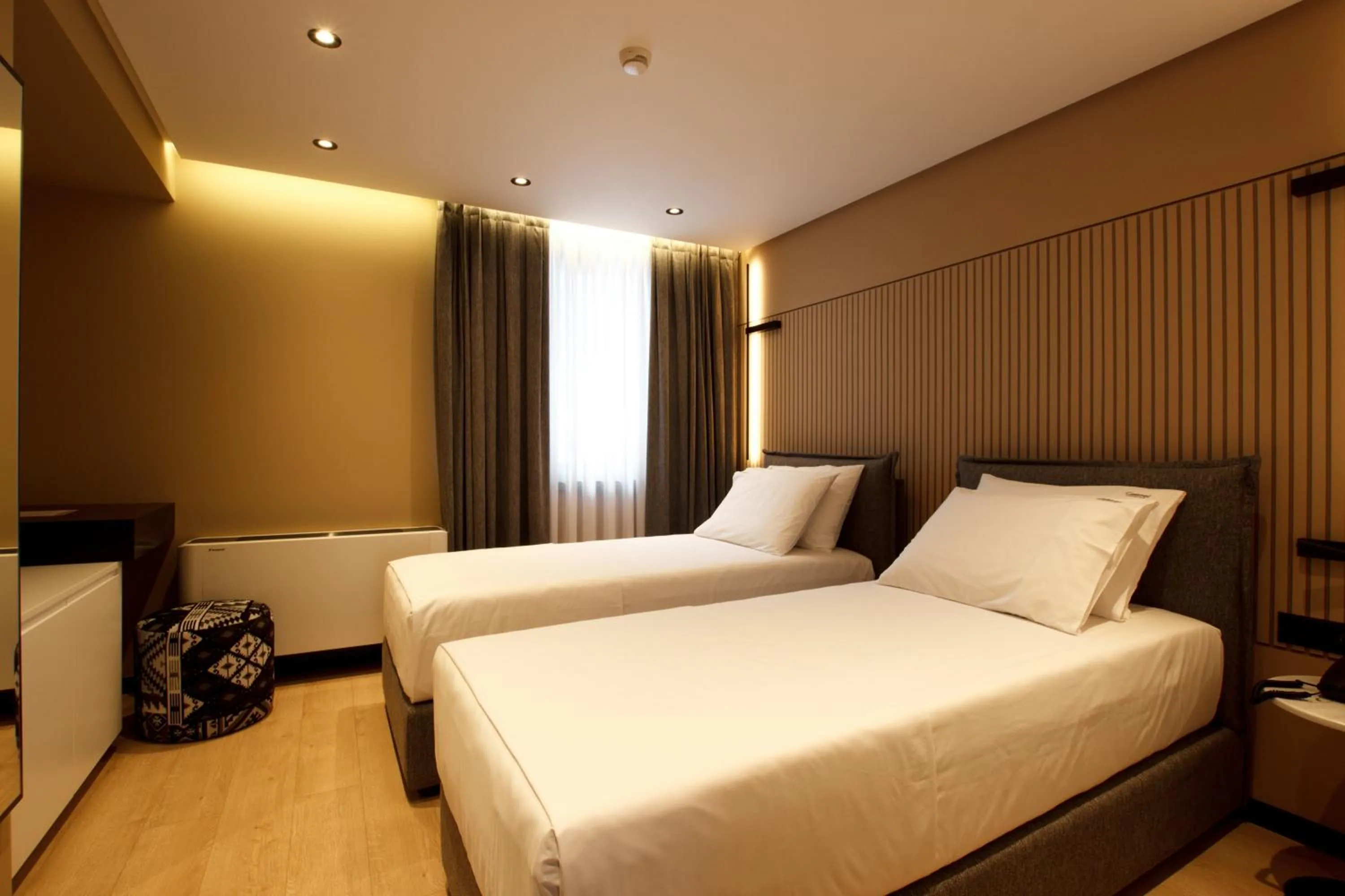 Bed in Caramel Boutique Hotel