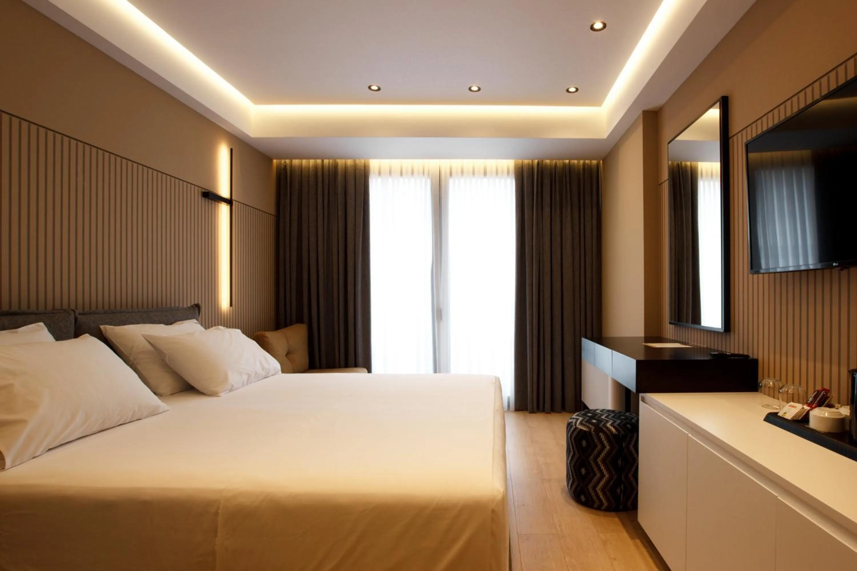 Bed in Caramel Boutique Hotel