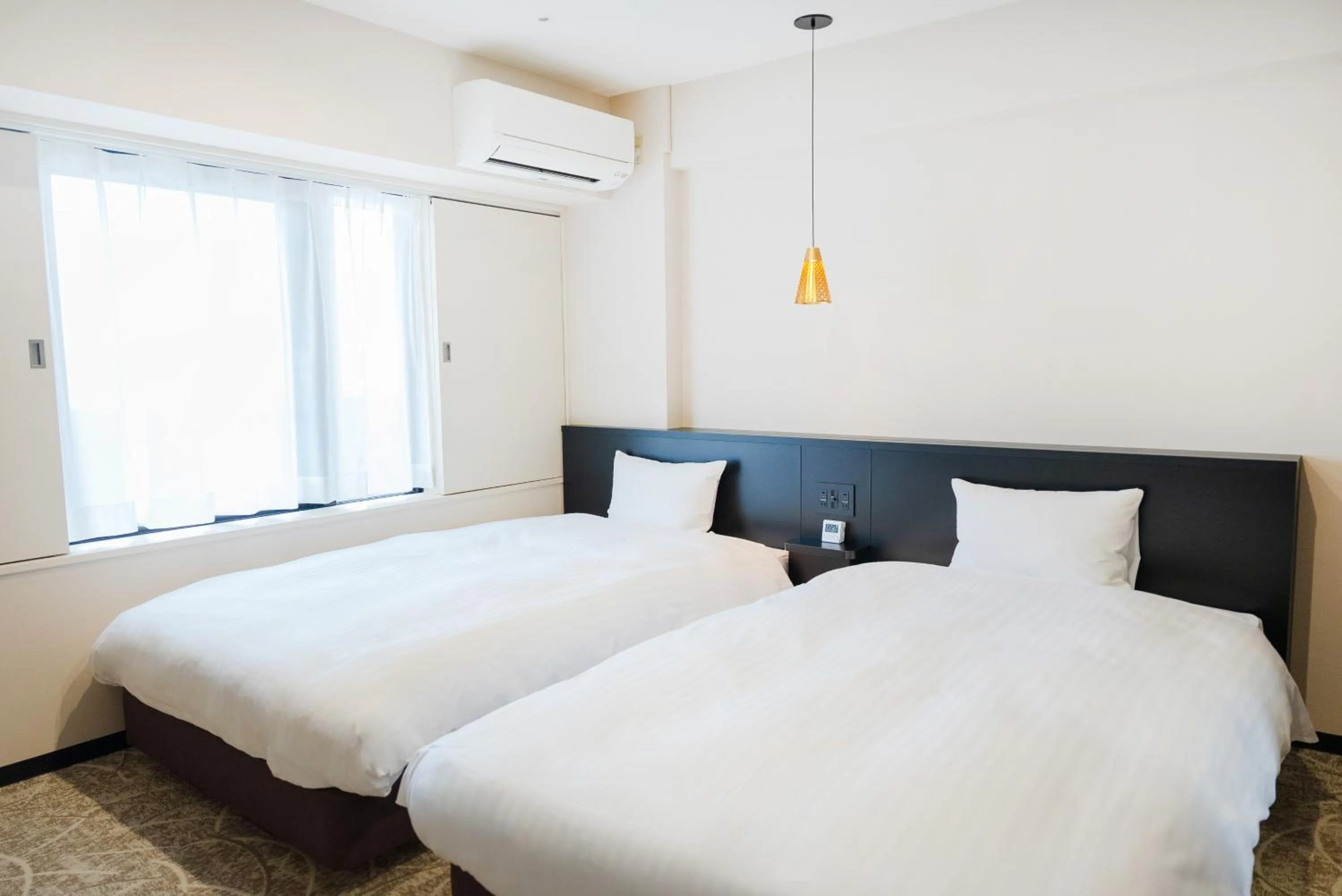 Bed in Hotel Alpha Inn Akita