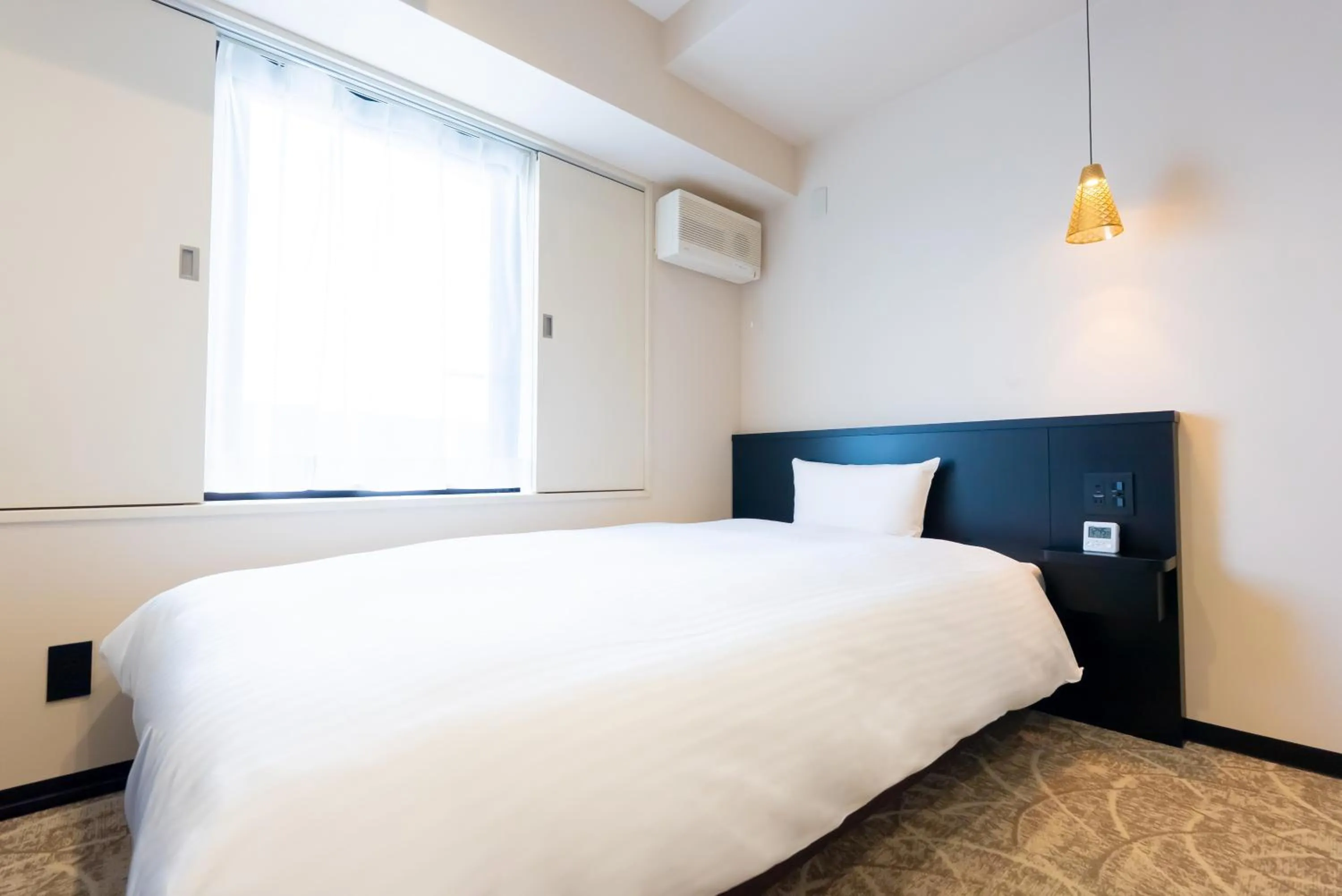 Bed in Hotel Alpha Inn Akita