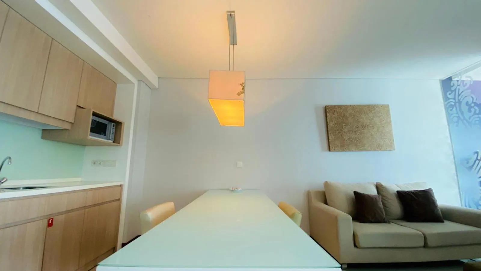 Kitchen or kitchenette, Bed in The H Tower Rasuna Suites Kuningan Jakarta By Villaloka