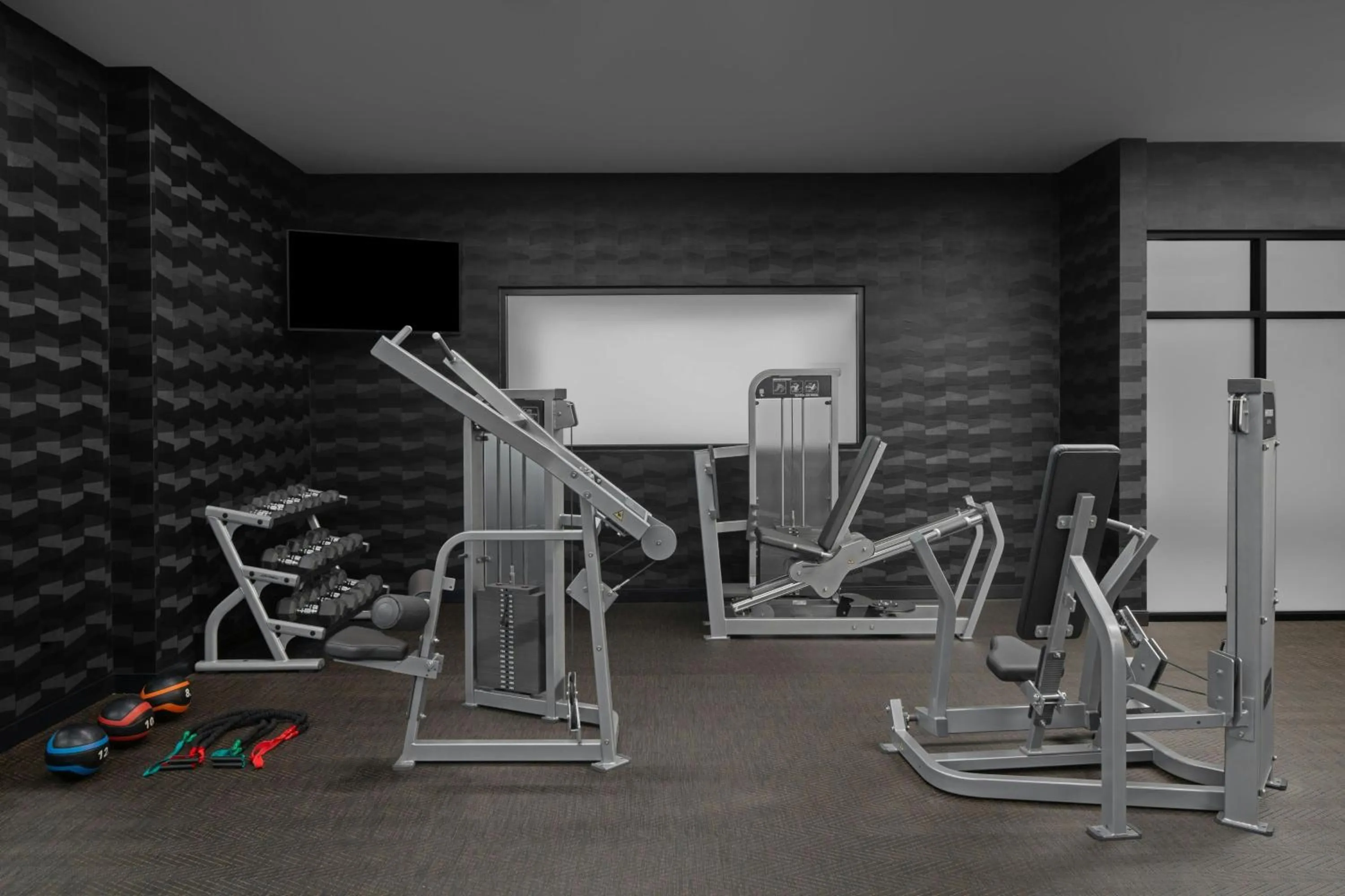Fitness centre/facilities in AC Hotel by Marriott Lansing University Area