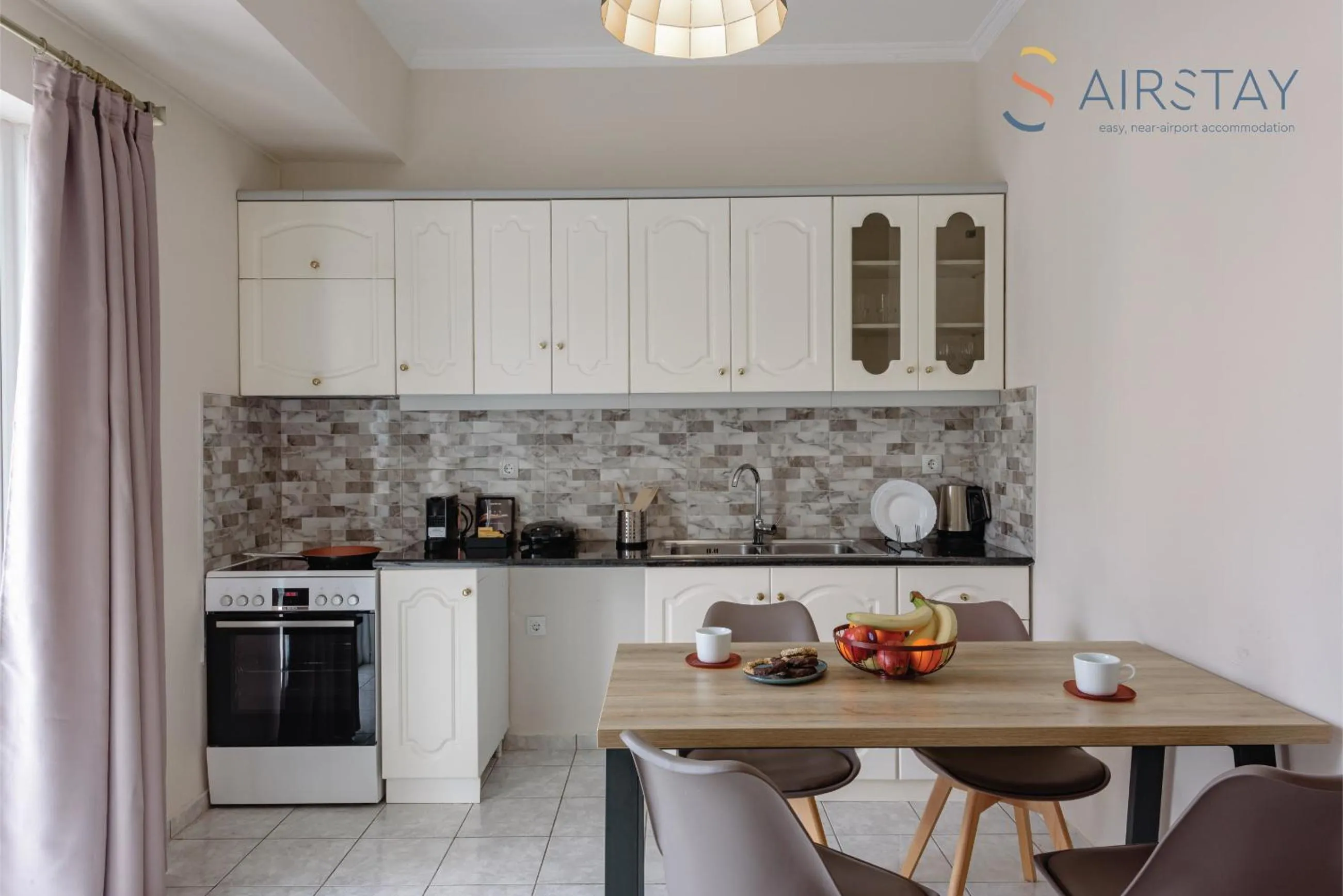 kitchen in Zilean Apartments Airport by Airstay
