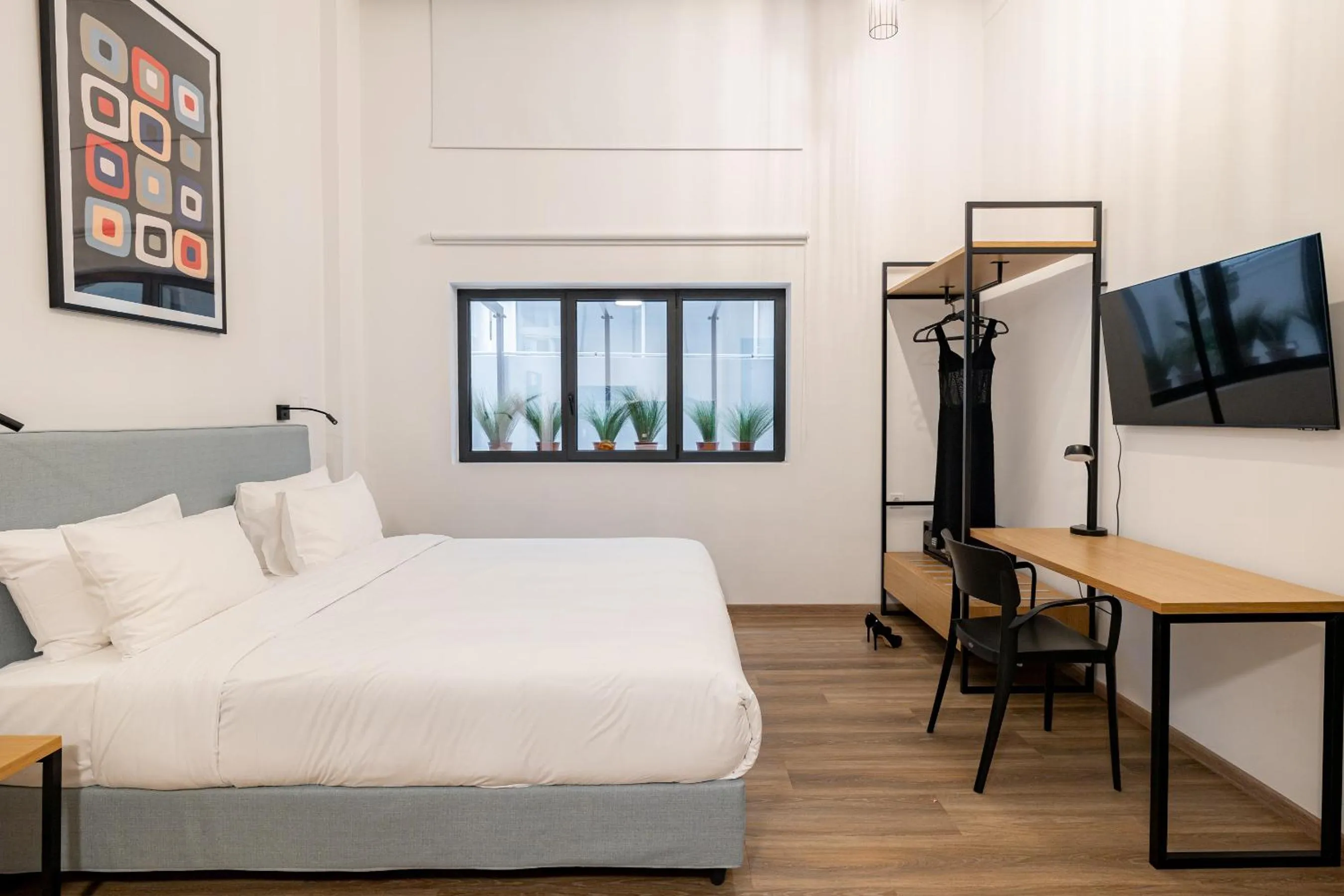 Photo of the whole room, Bed in Earos Urban Living