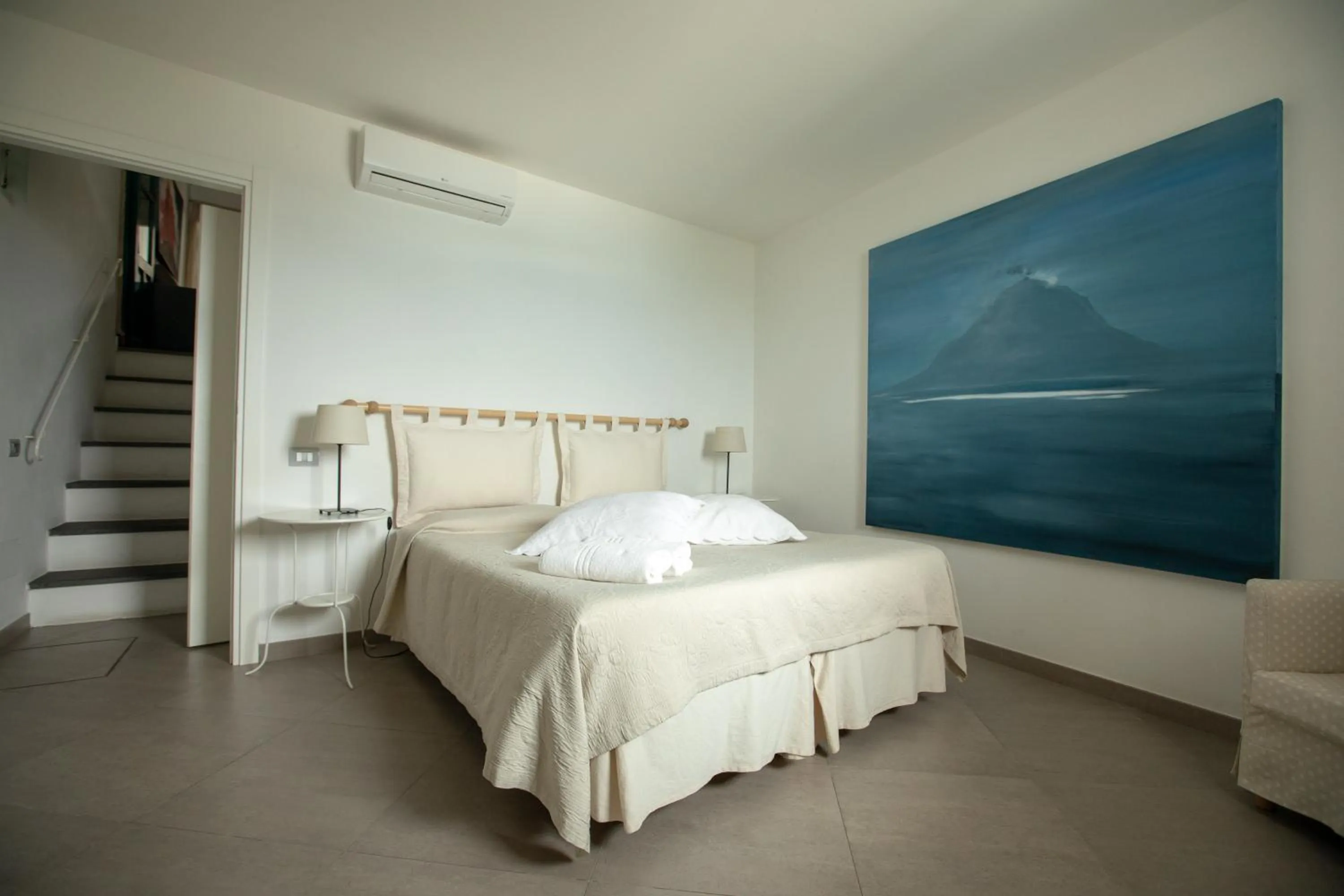 Bed in Il Gabbiano Relais in Stromboli