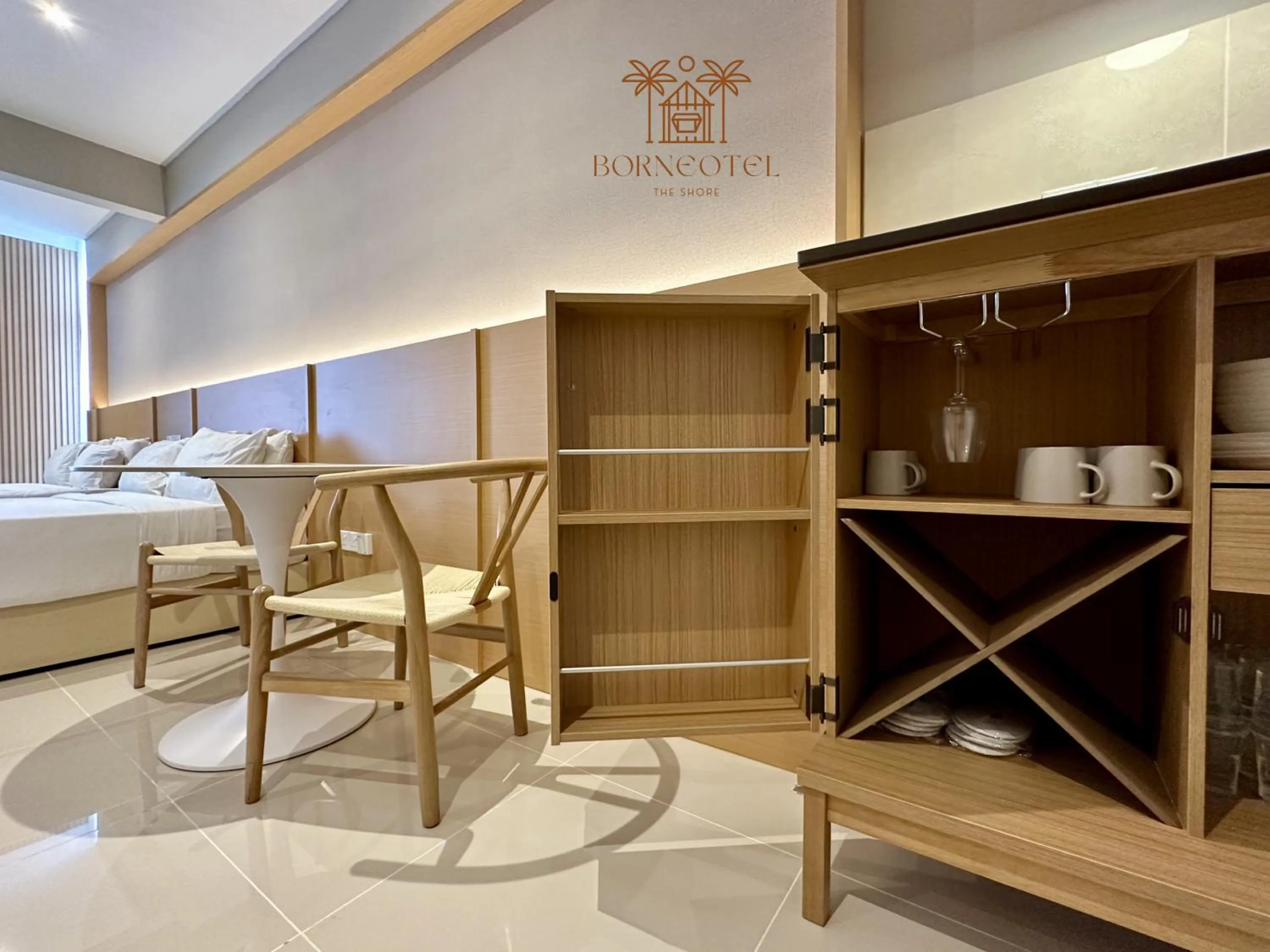 Kitchen or kitchenette, Bed in Borneotel The Shore KK by CHG