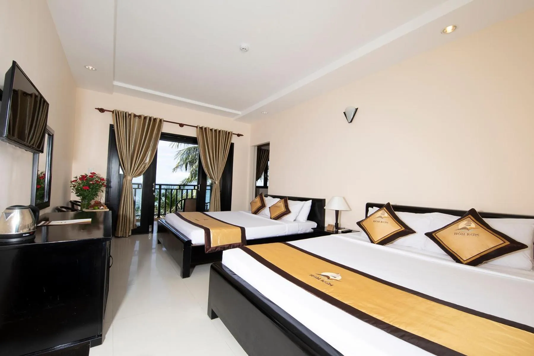 Bed in Hon Rom Central Beach Resort