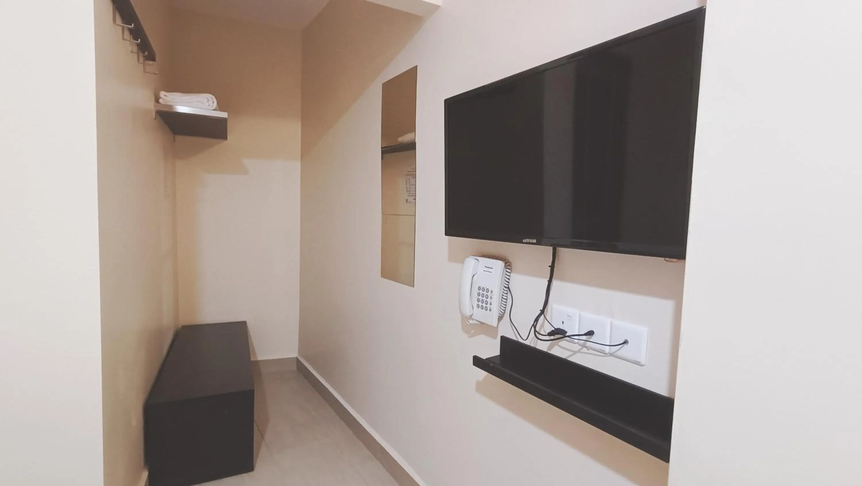 Bedroom in Capital O 90897 Island City Hotel