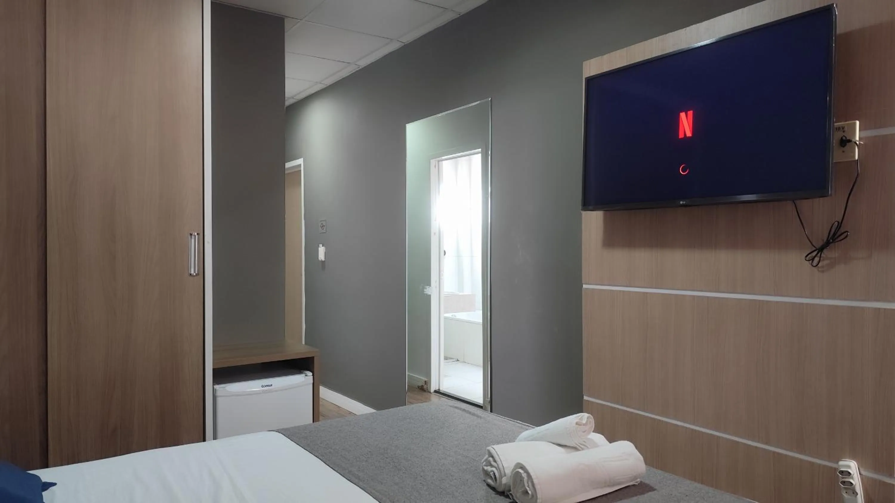 Bed in Assay Plaza Hotel