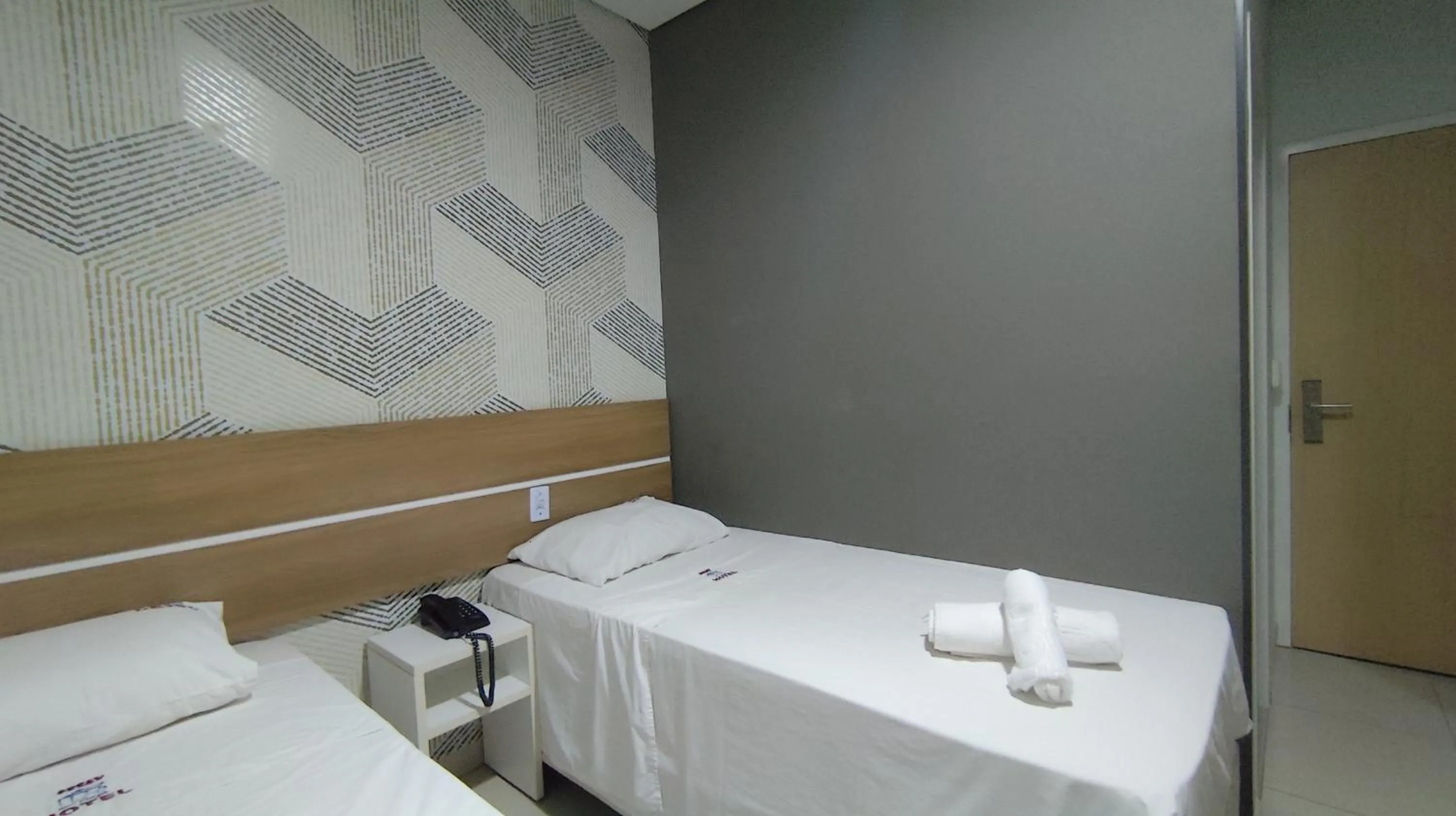 Bed in Assay Plaza Hotel