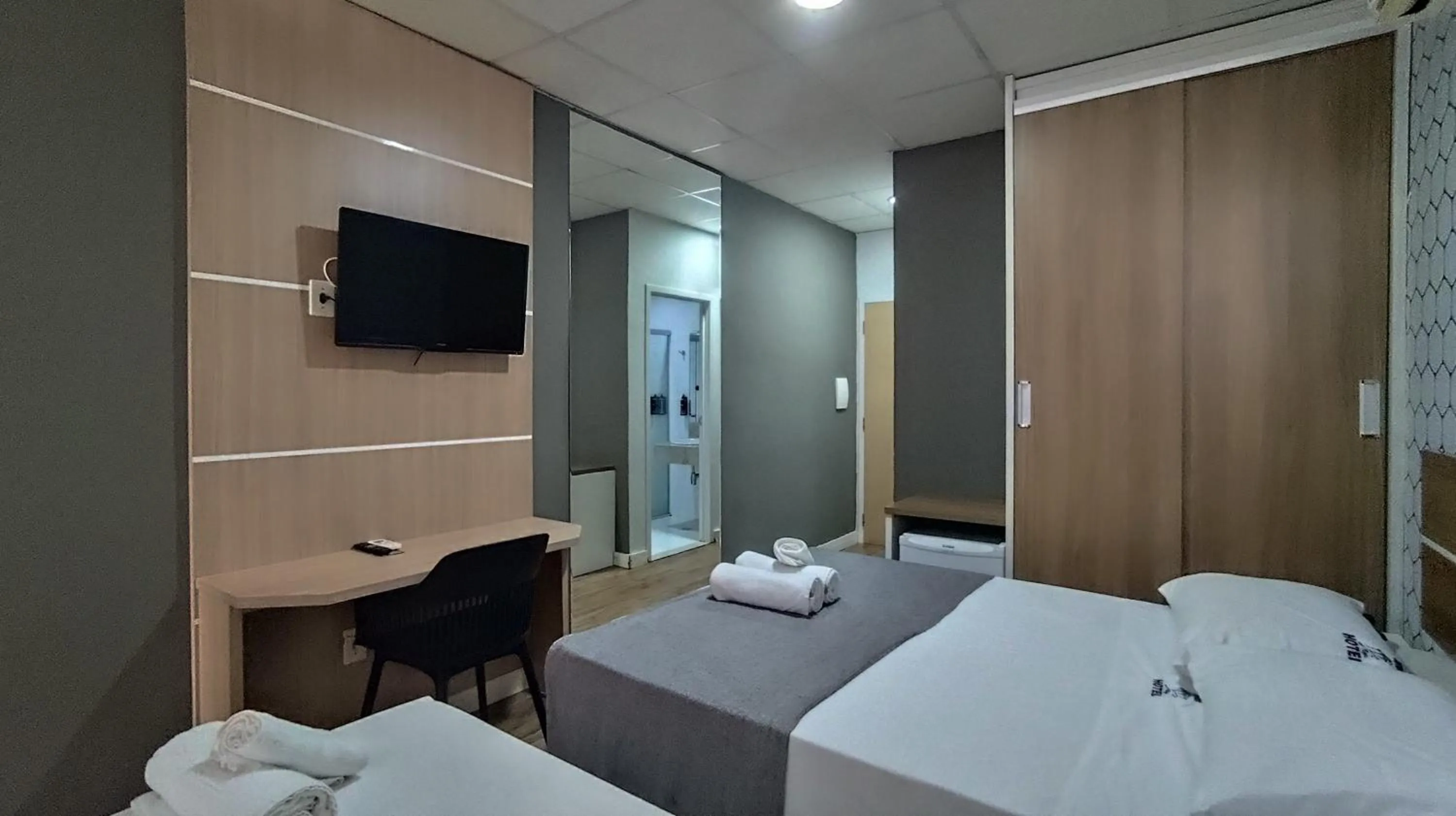 Bed in Assay Plaza Hotel