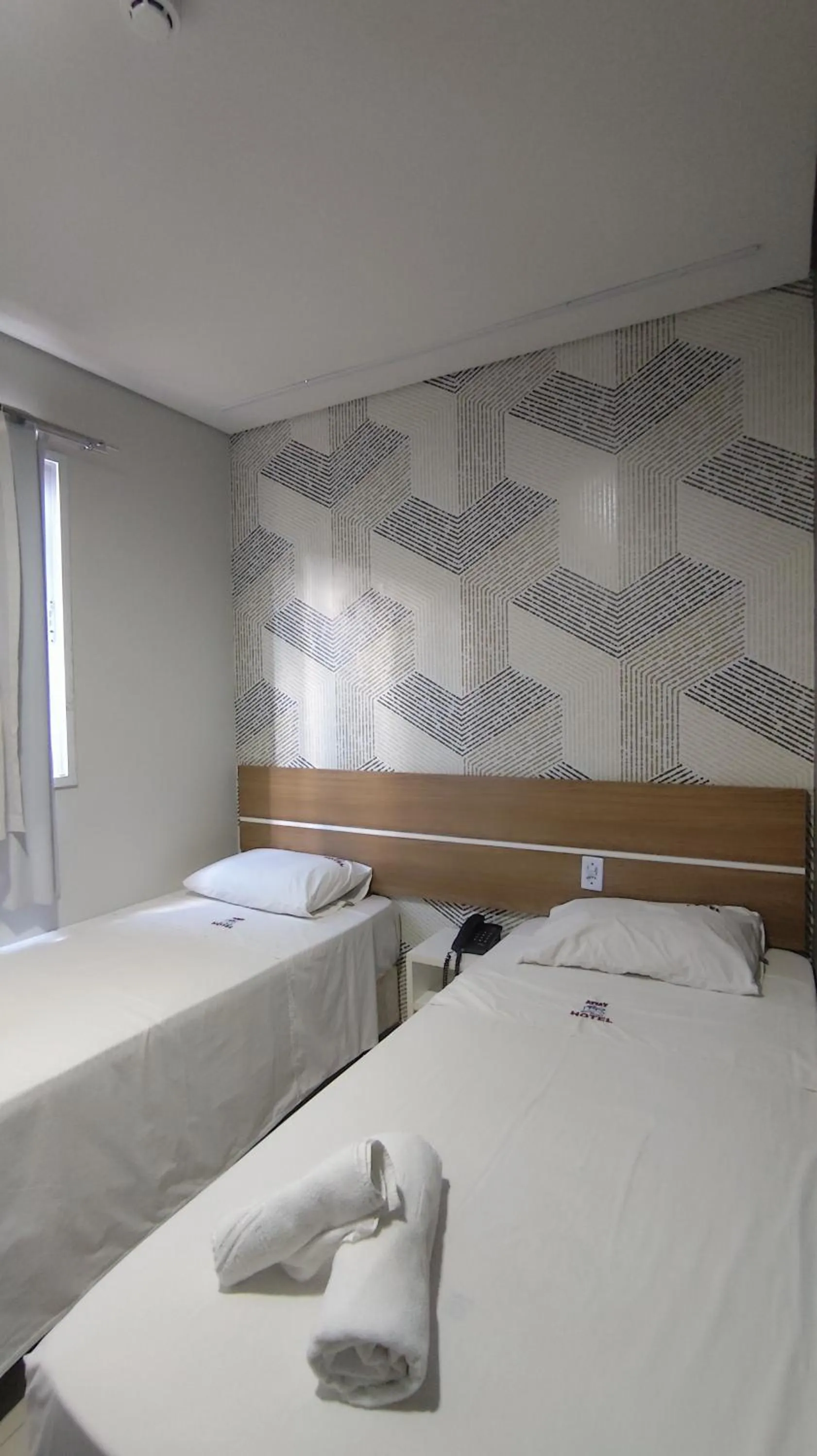 Bed in Assay Plaza Hotel