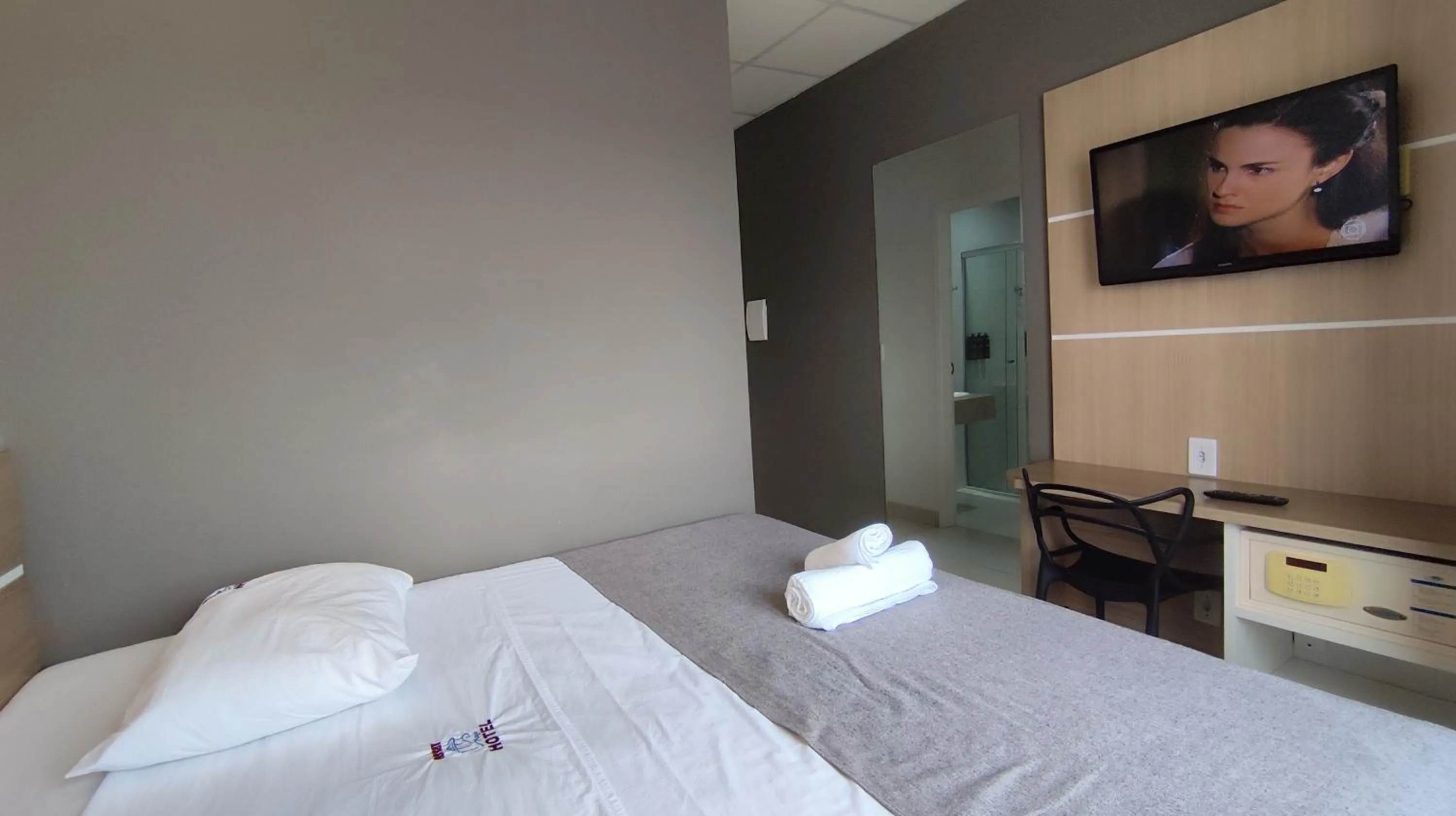 Bed in Assay Plaza Hotel