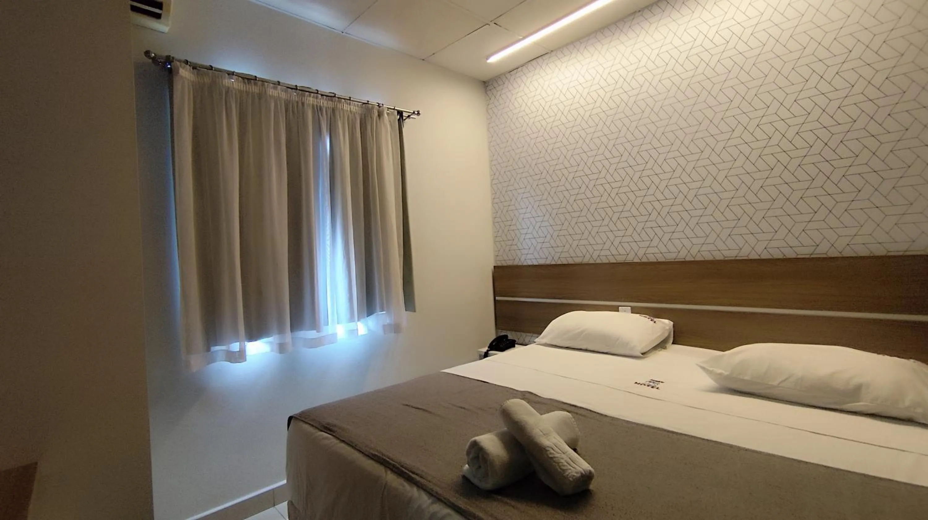 Bed in Assay Plaza Hotel