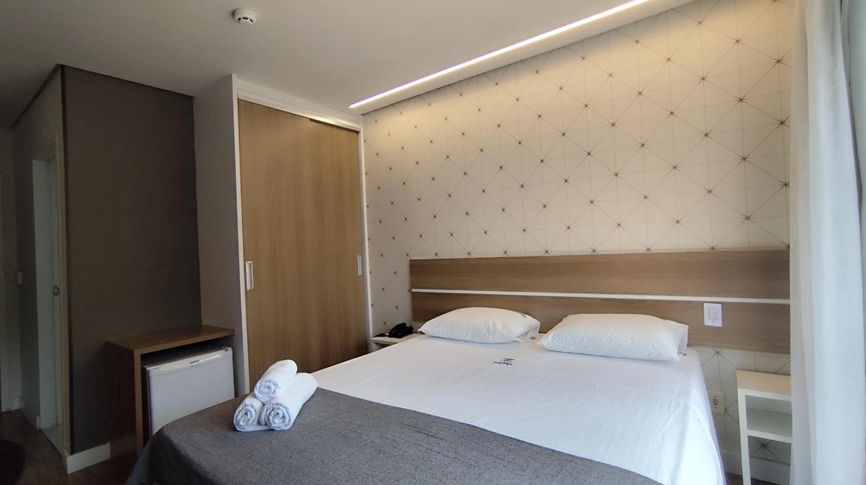 Bed in Assay Plaza Hotel