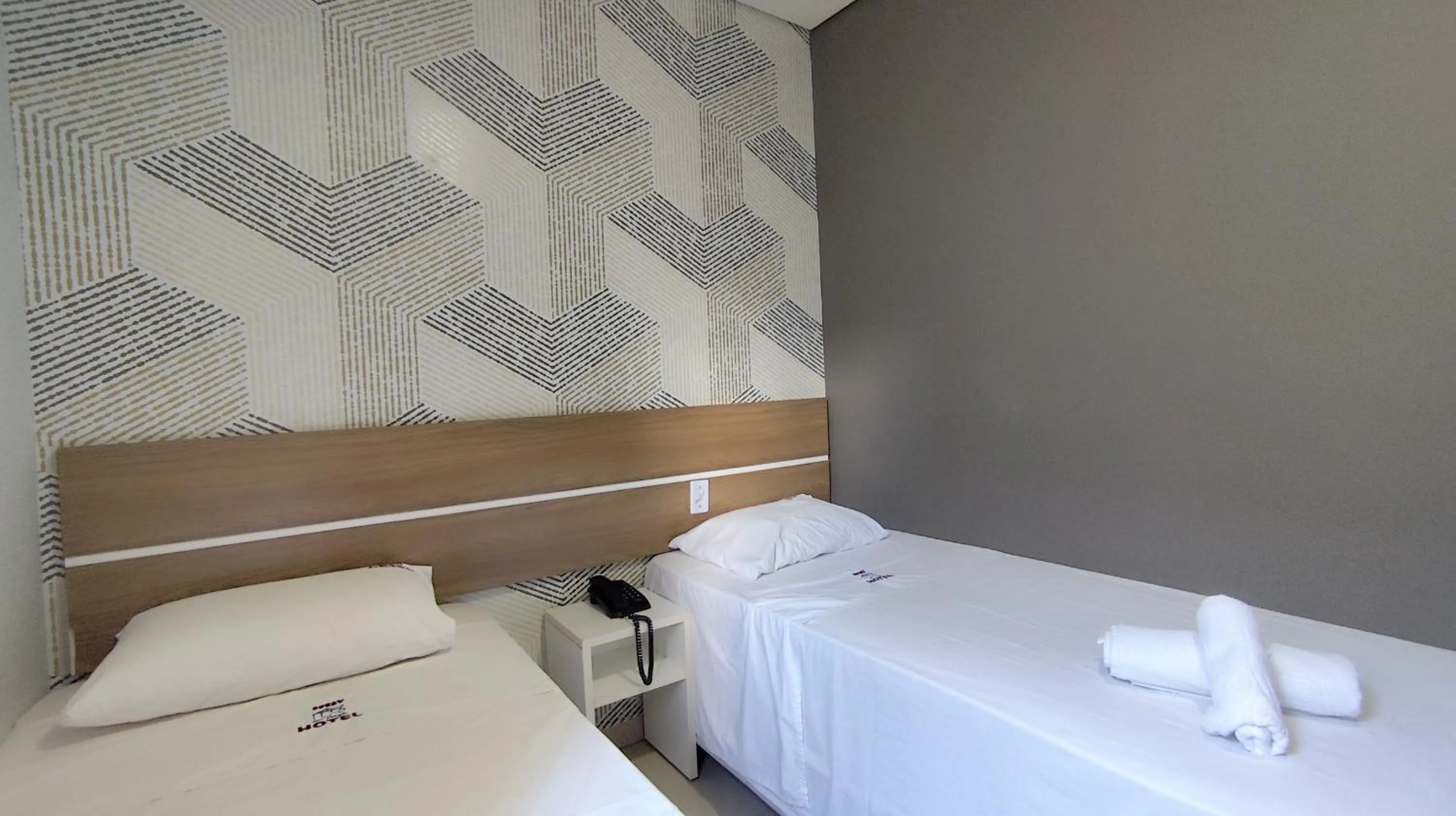 Bed in Assay Plaza Hotel