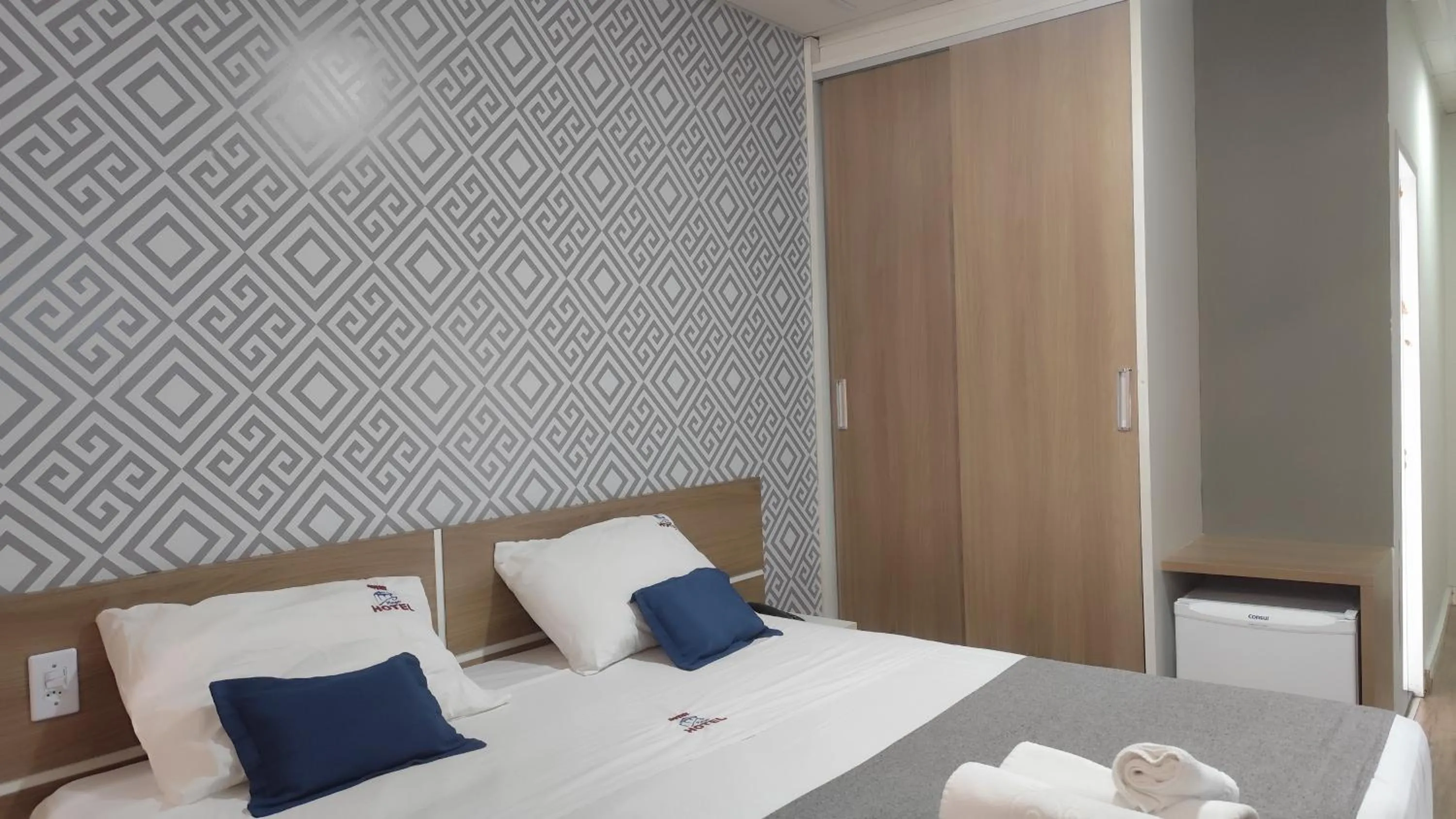 Bed in Assay Plaza Hotel