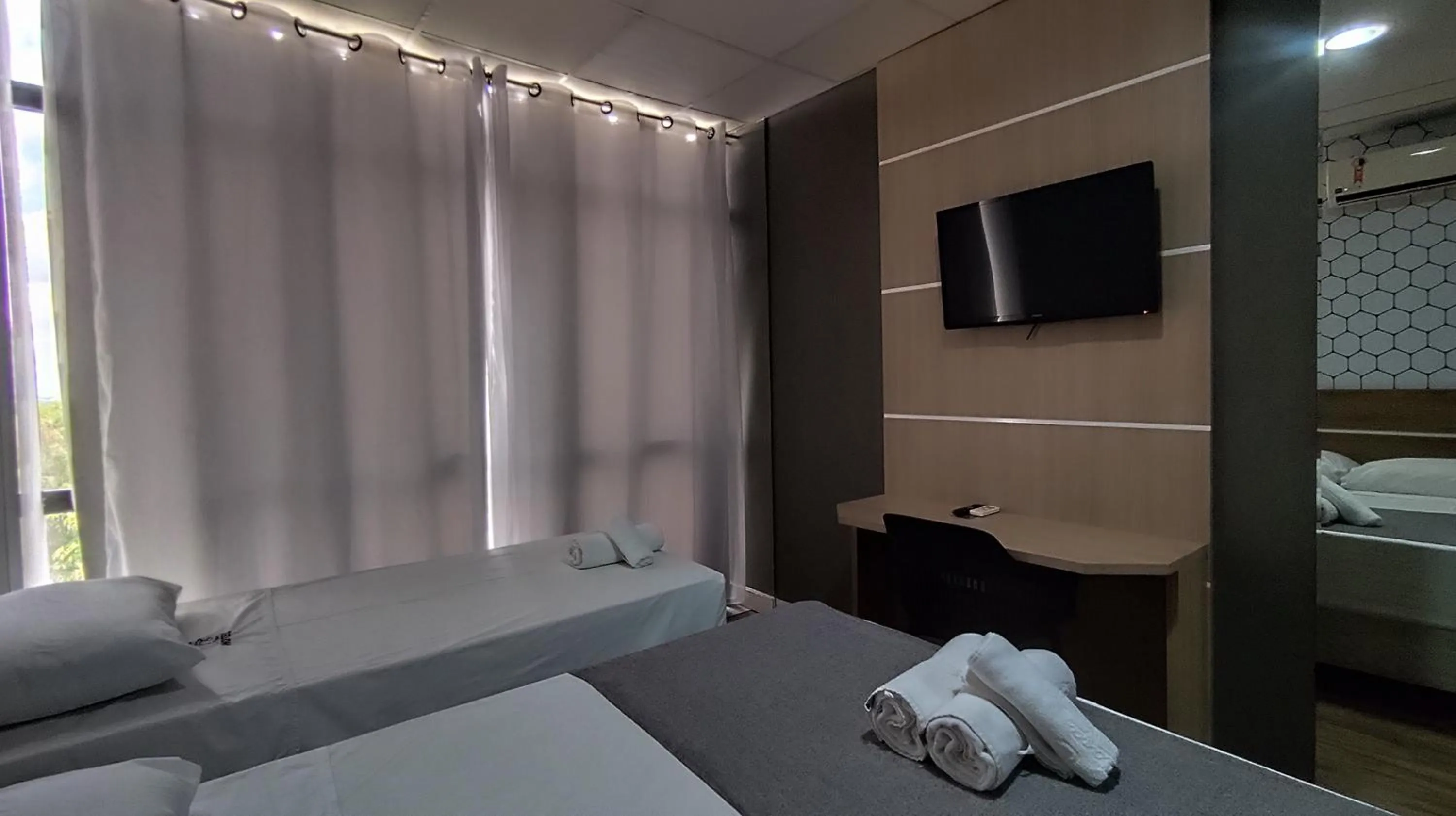 Bed in Assay Plaza Hotel