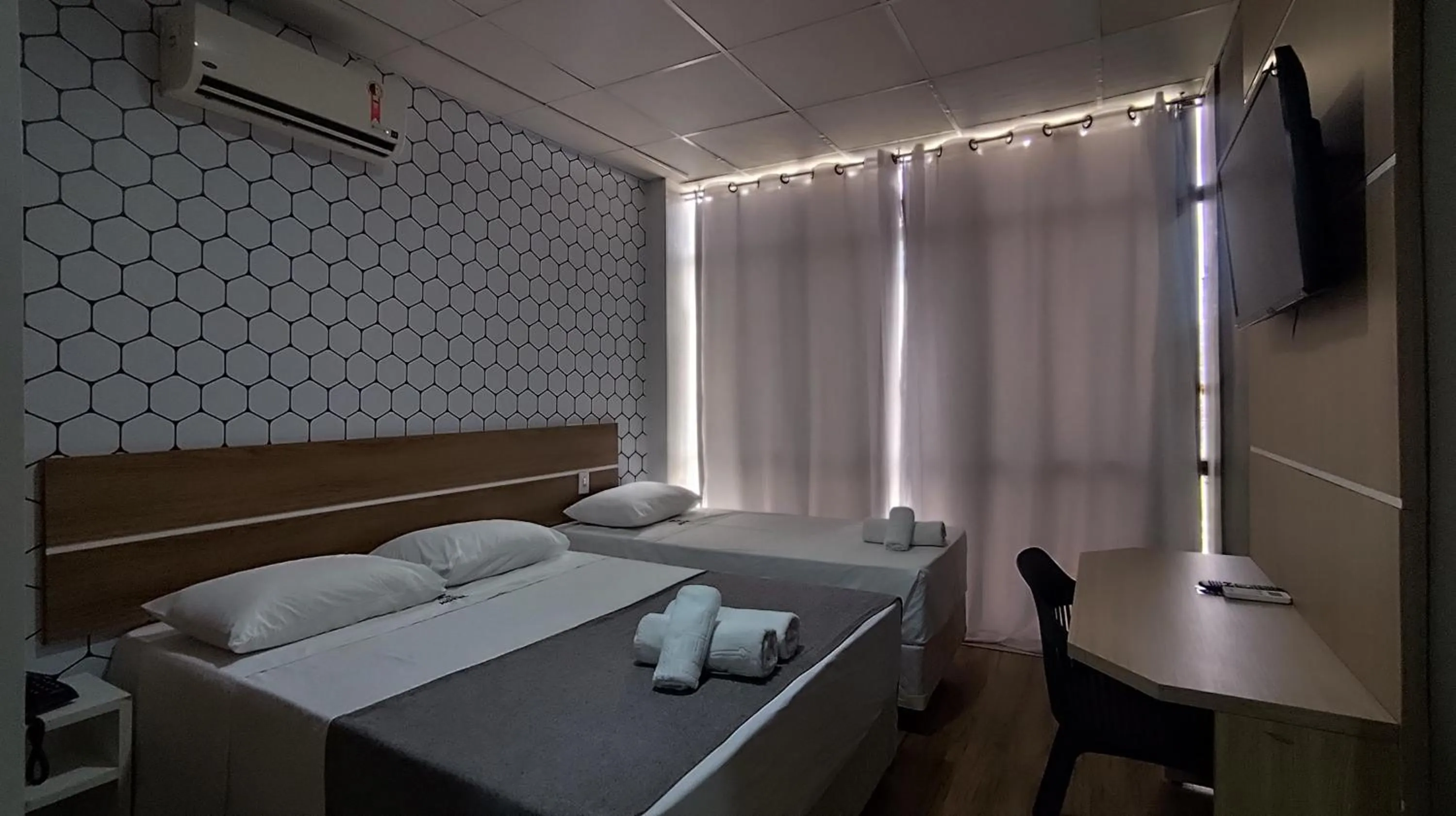 Bed in Assay Plaza Hotel