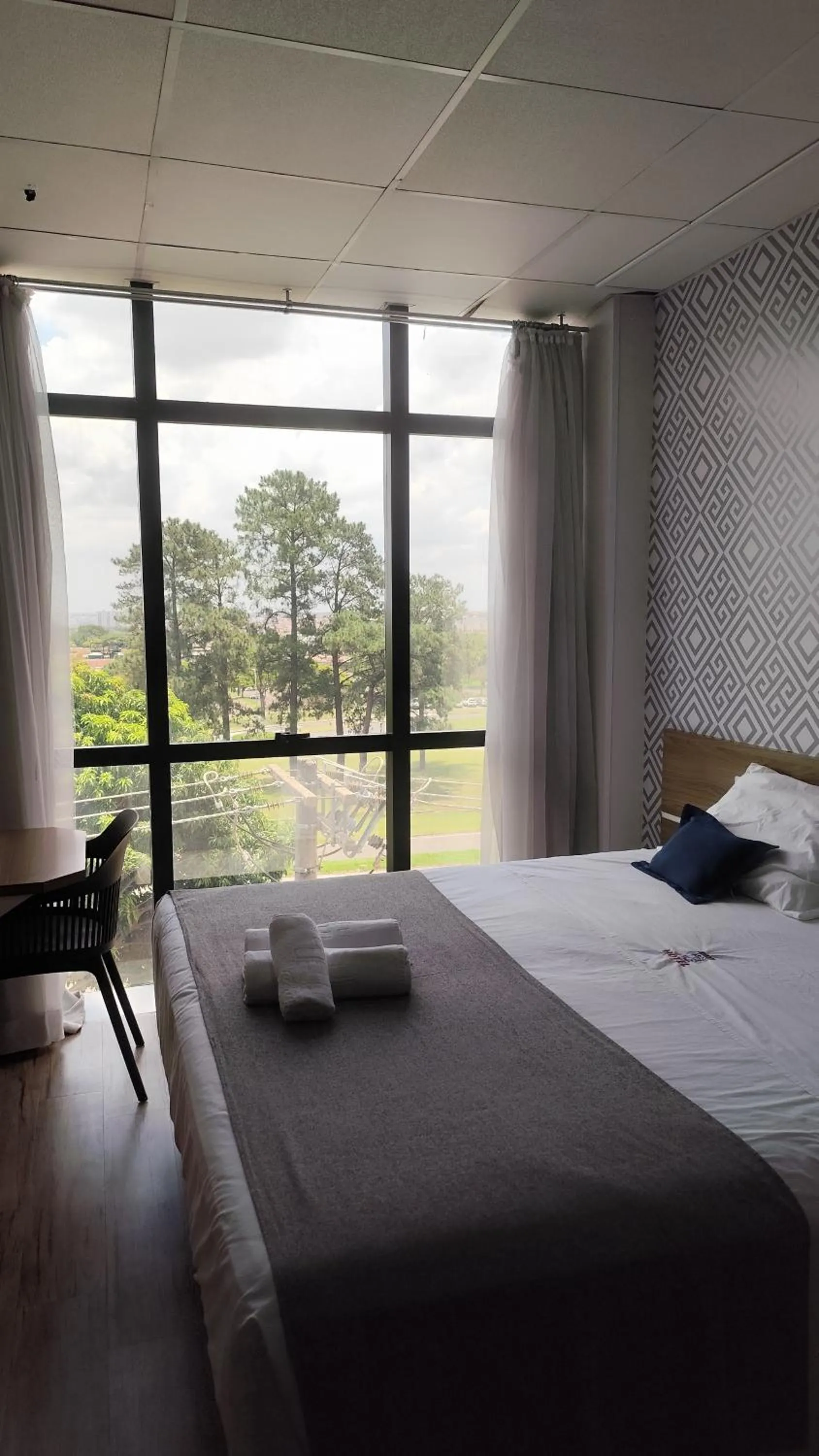 Bed in Assay Plaza Hotel