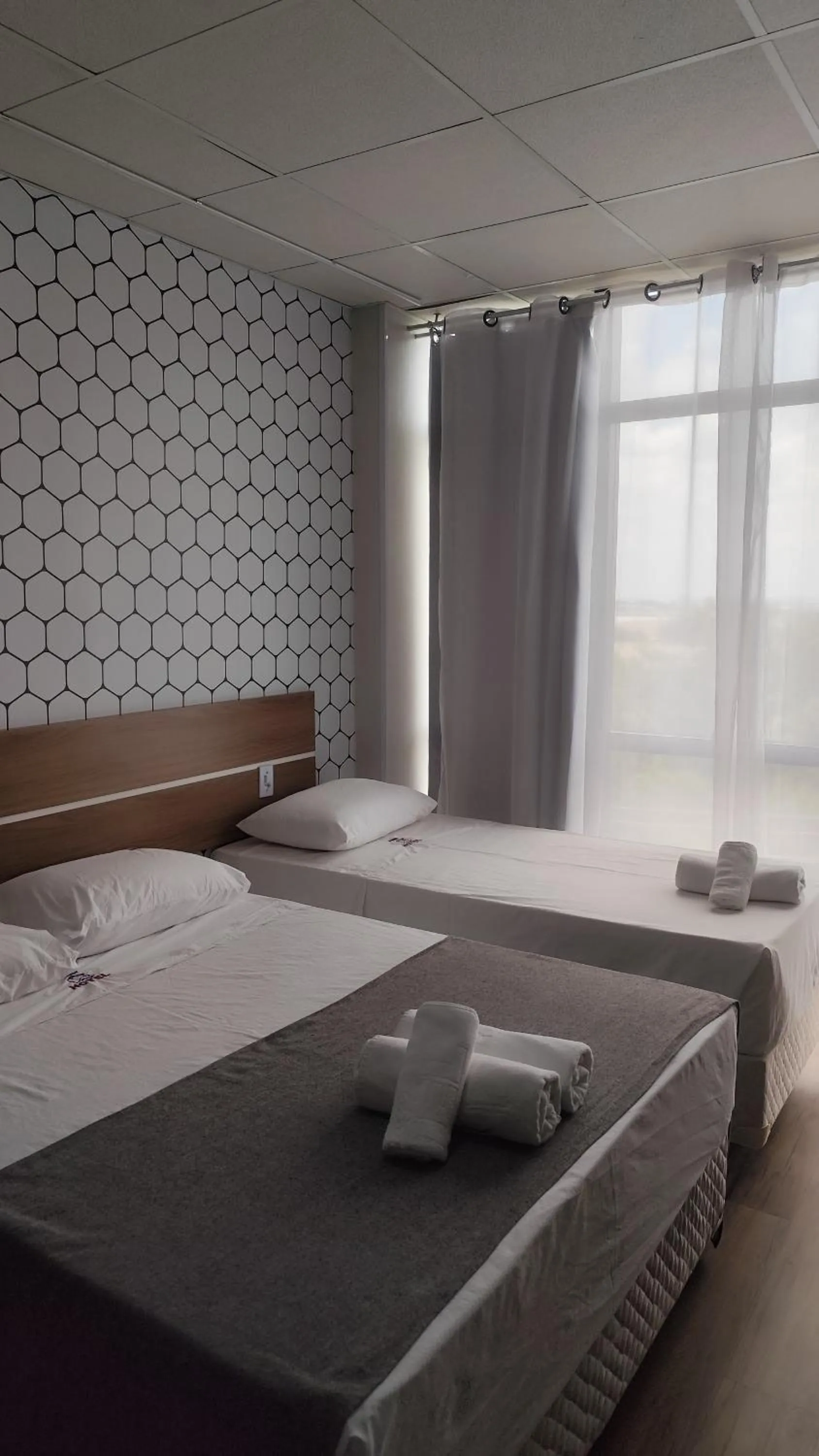 Bed in Assay Plaza Hotel